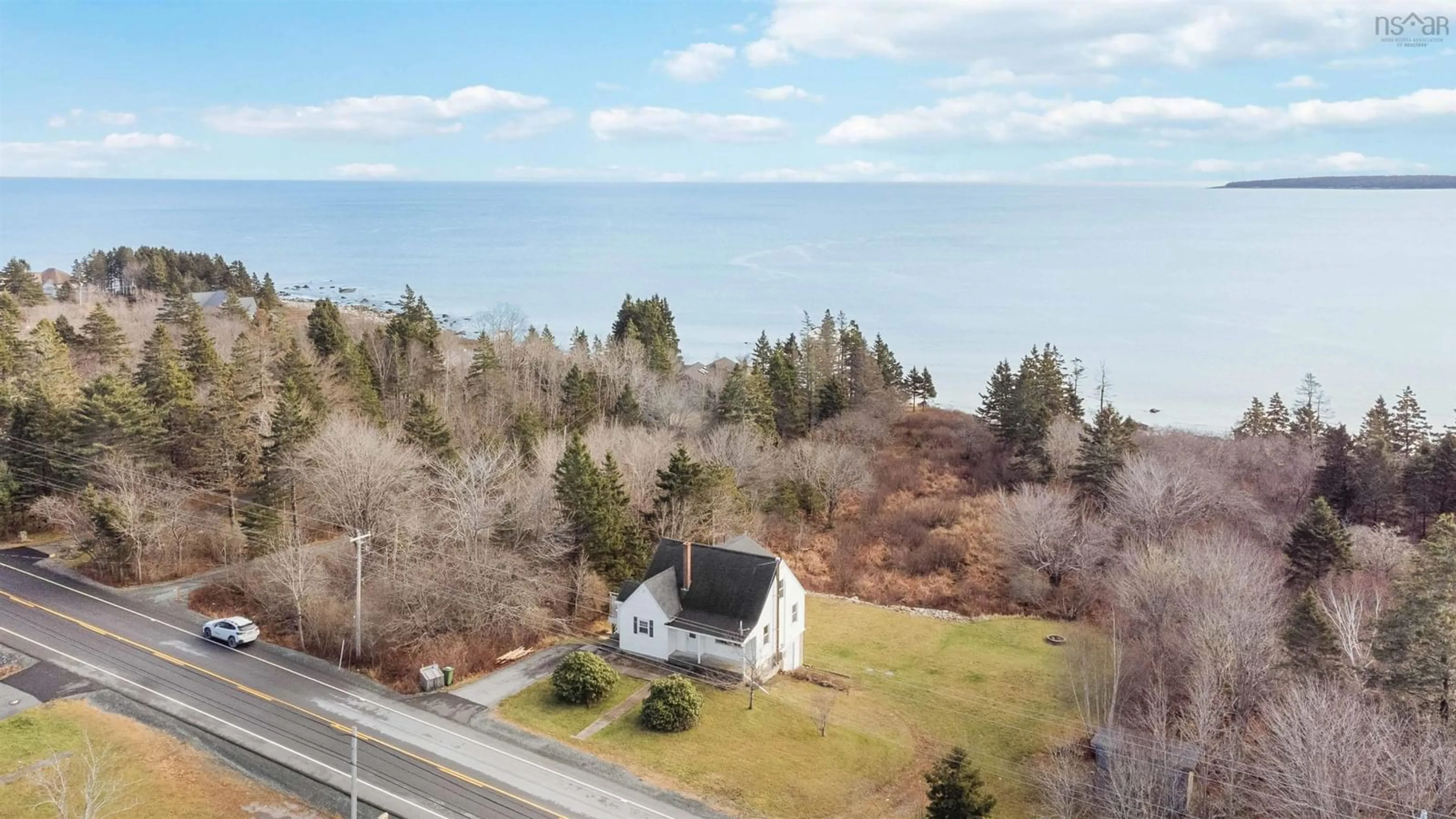 A pic from outside/outdoor area/front of a property/back of a property/a pic from drone, water/lake/river/ocean view for 6921 Highway 3, Hunts Point Nova Scotia B0T 1G0