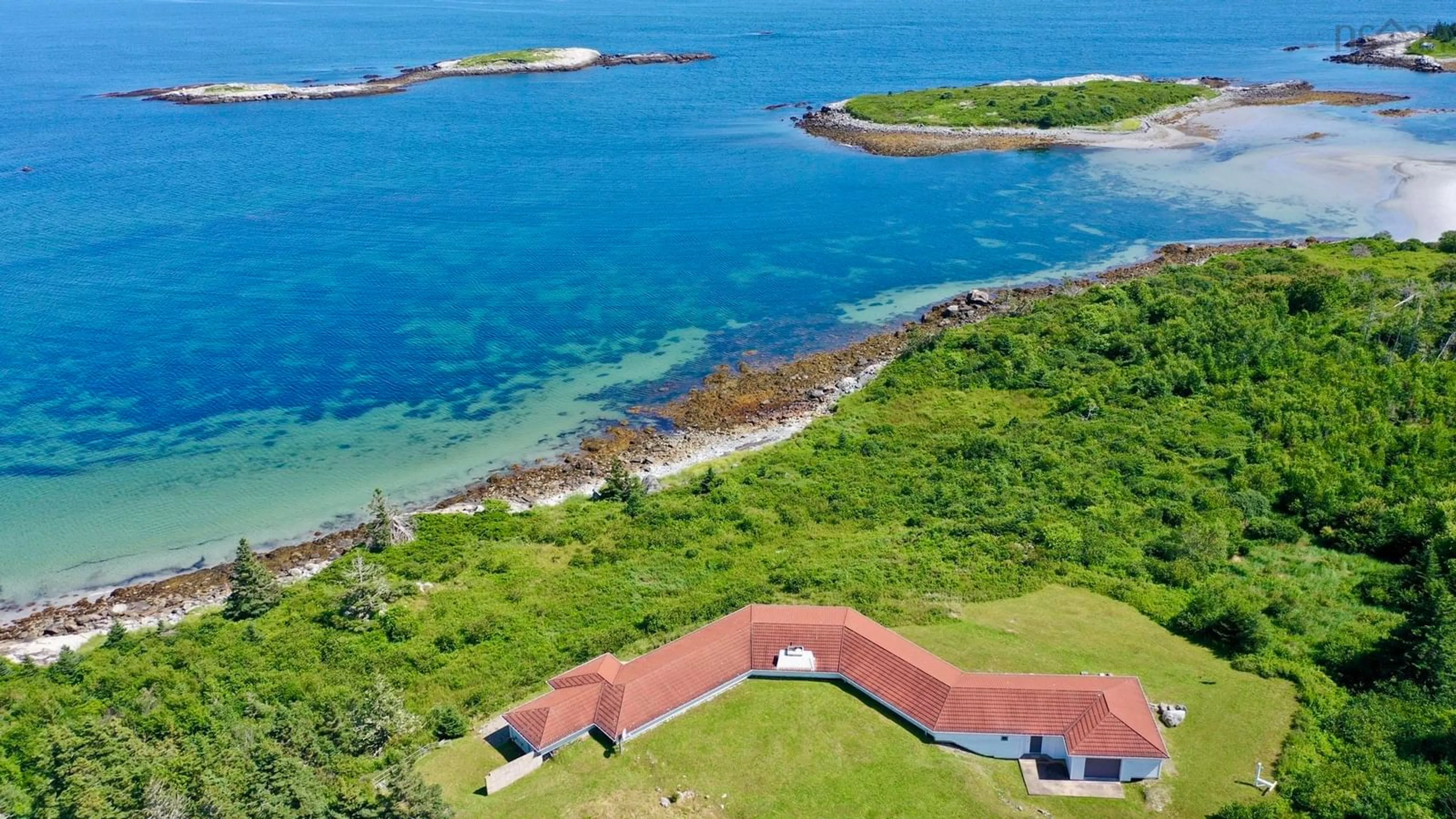 A pic from outside/outdoor area/front of a property/back of a property/a pic from drone, water/lake/river/ocean view for 215 West Head Rd, Western Head Nova Scotia B0T 1L0