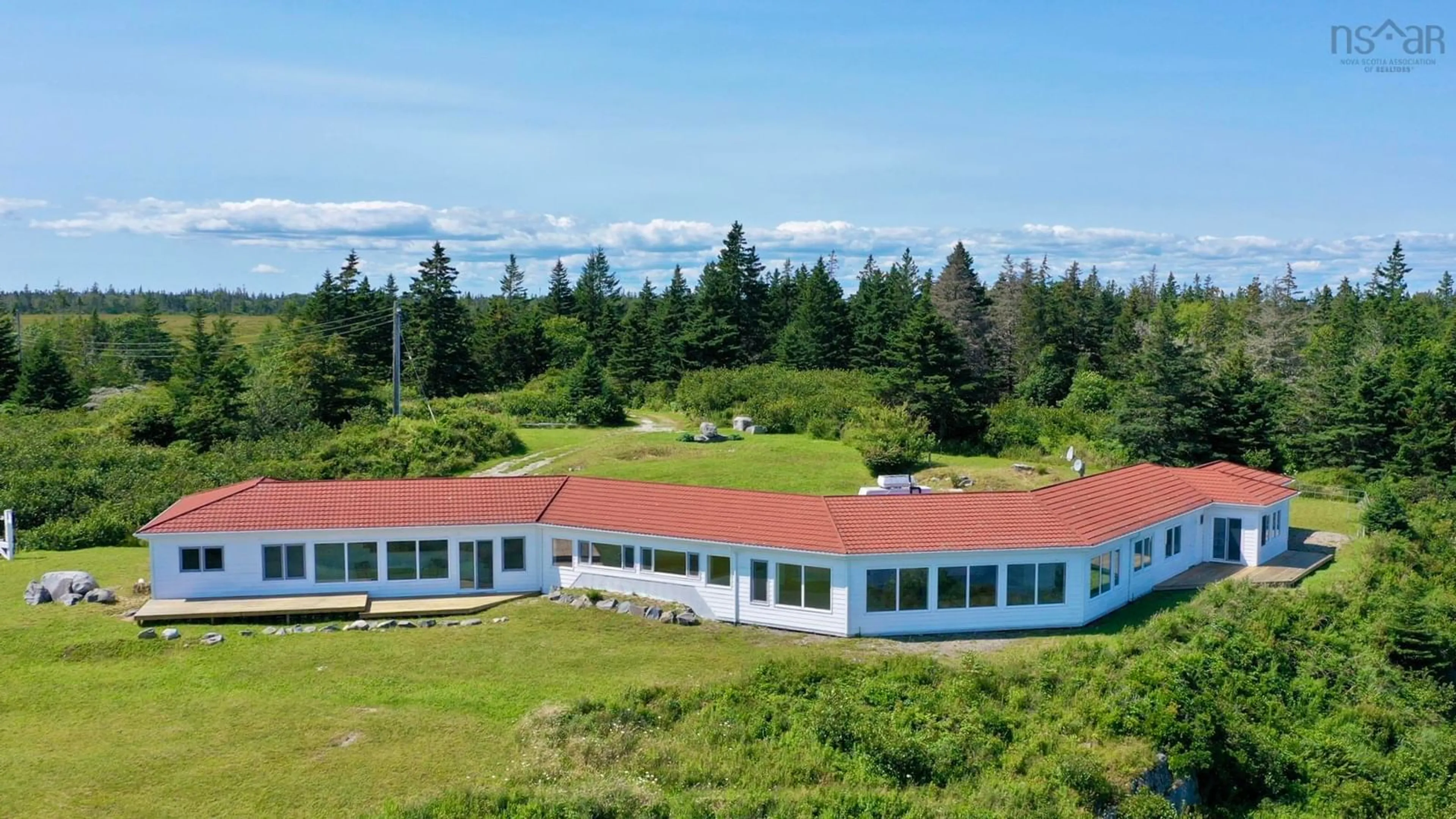 A pic from outside/outdoor area/front of a property/back of a property/a pic from drone, water/lake/river/ocean view for 215 West Head Rd, Western Head Nova Scotia B0T 1L0