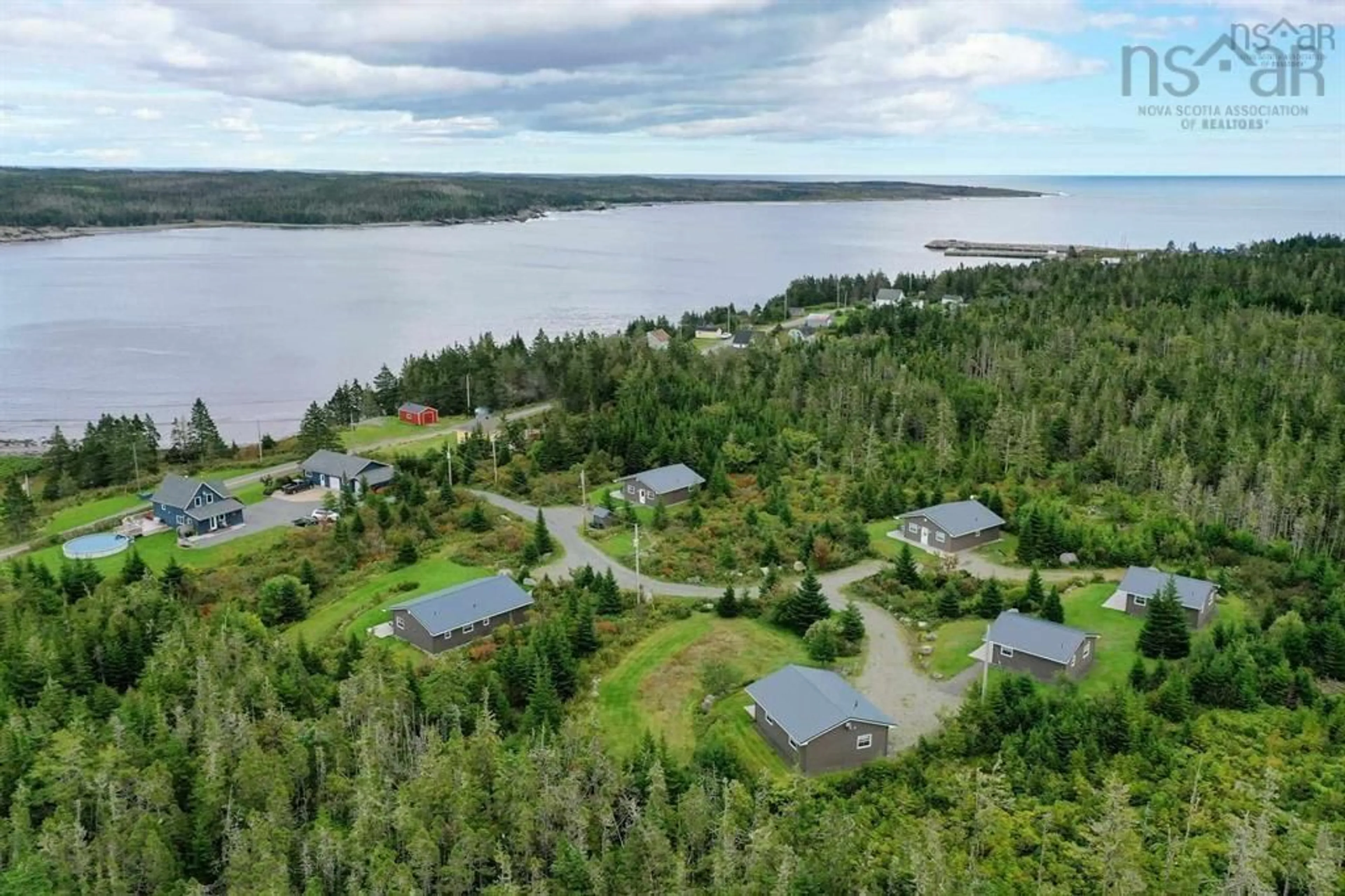 A pic from outside/outdoor area/front of a property/back of a property/a pic from drone, water/lake/river/ocean view for 150 New Harbour Rd, New Harbour Nova Scotia B0H 1T0