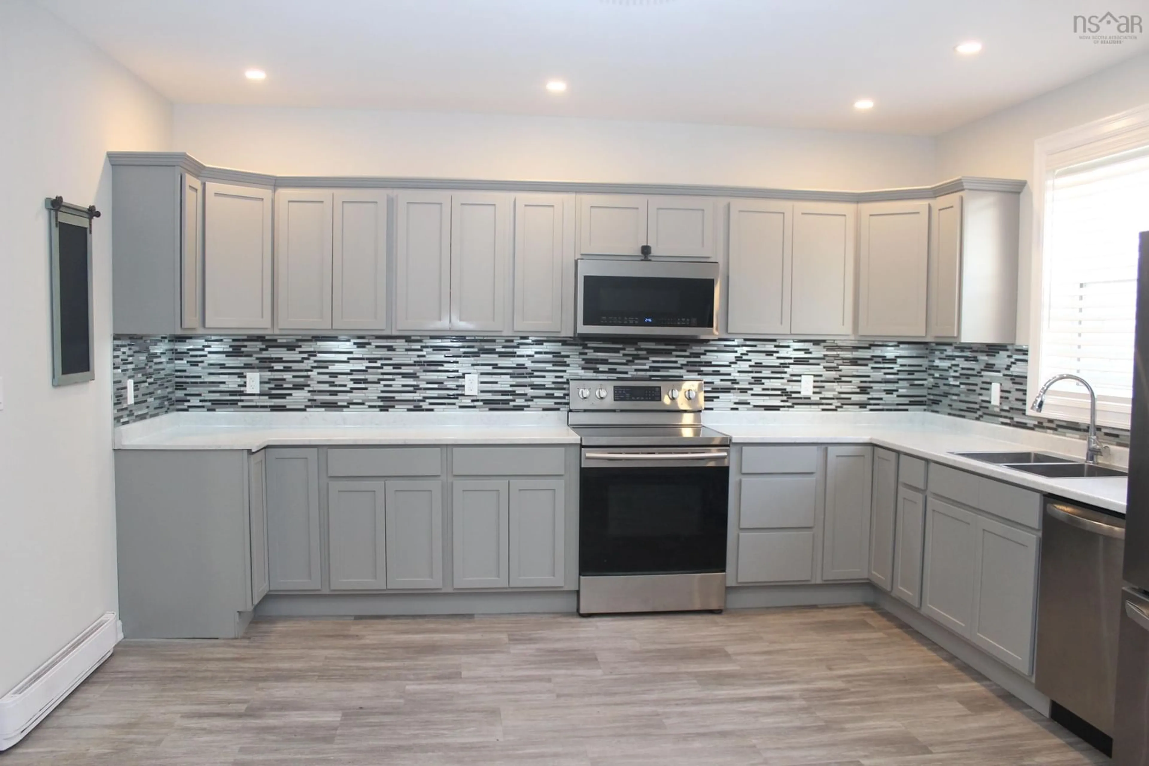 Open concept kitchen, ceramic/tile floor for 140 Victoria St, Glace Bay Nova Scotia B1A 2Z8