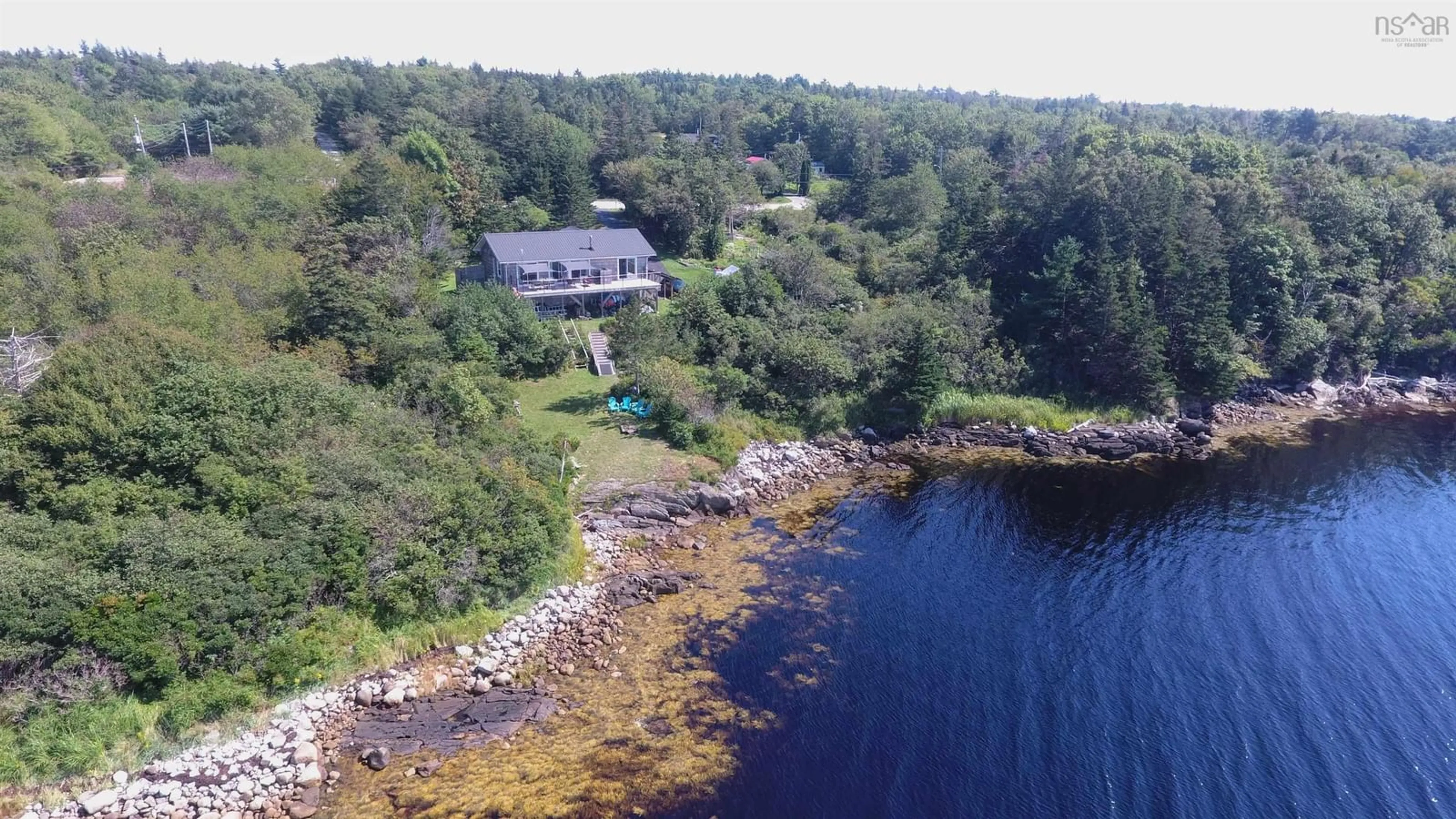 A pic from outside/outdoor area/front of a property/back of a property/a pic from drone, water/lake/river/ocean view for 1050 Sandy Point Rd, Sandy Point Nova Scotia B0T 1W0