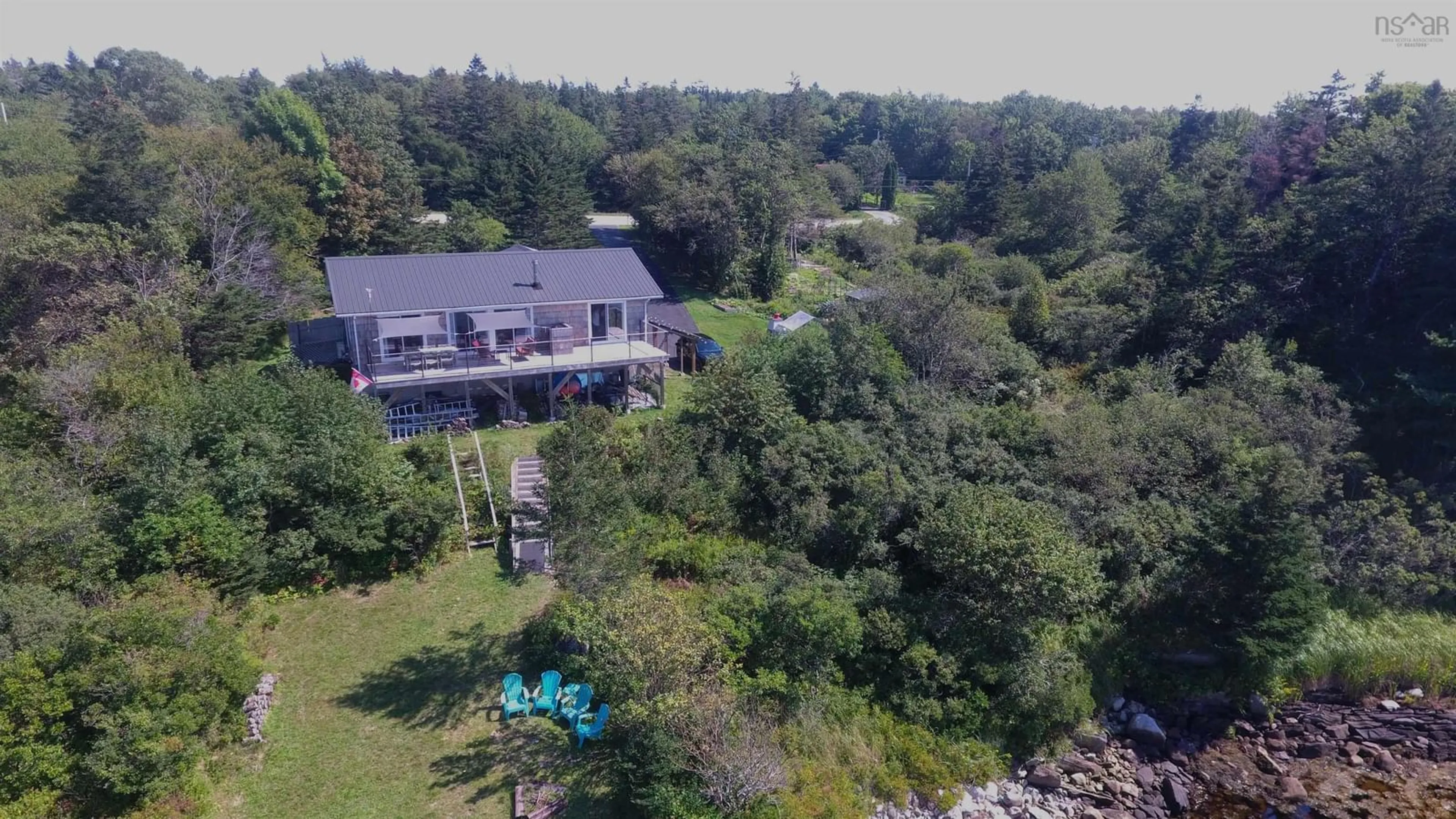 A pic from outside/outdoor area/front of a property/back of a property/a pic from drone, water/lake/river/ocean view for 1050 Sandy Point Rd, Sandy Point Nova Scotia B0T 1W0