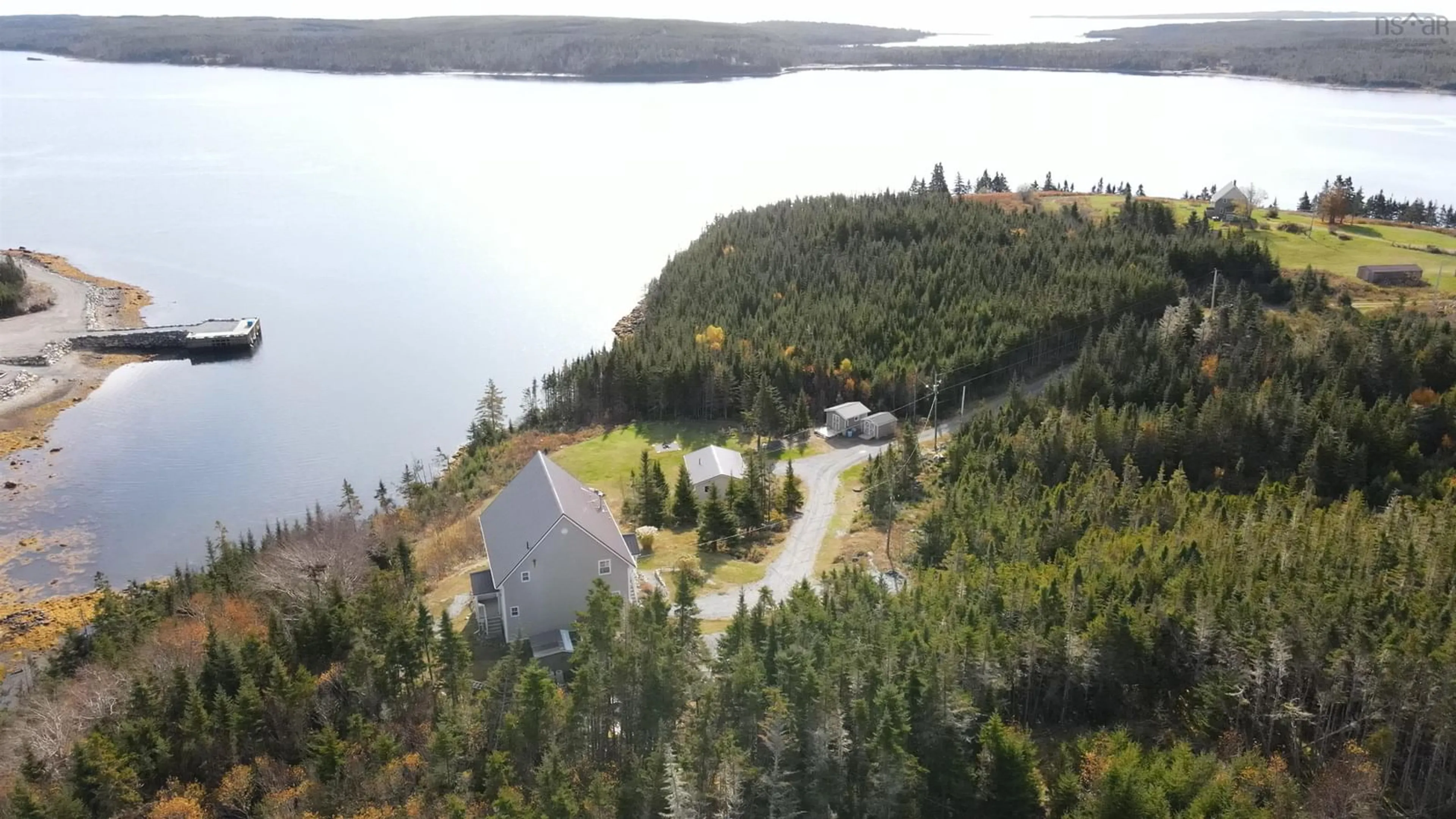 A pic from outside/outdoor area/front of a property/back of a property/a pic from drone, water/lake/river/ocean view for 63 Wilson Rd, Wilsons Cove Nova Scotia B0J 2A0