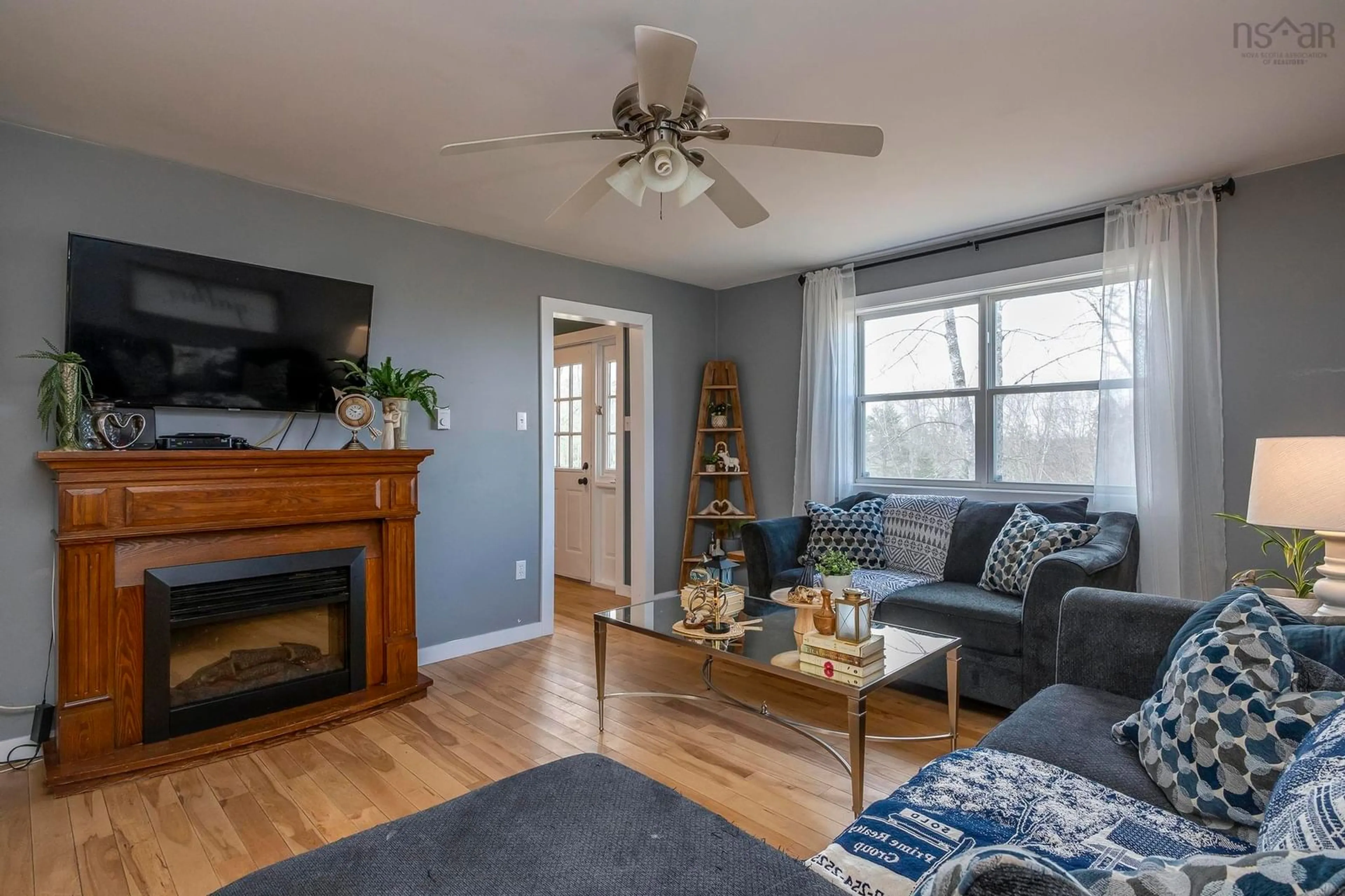 Living room with furniture, wood/laminate floor for 8322 Highway 14, McKay Section Nova Scotia B0N 2A0