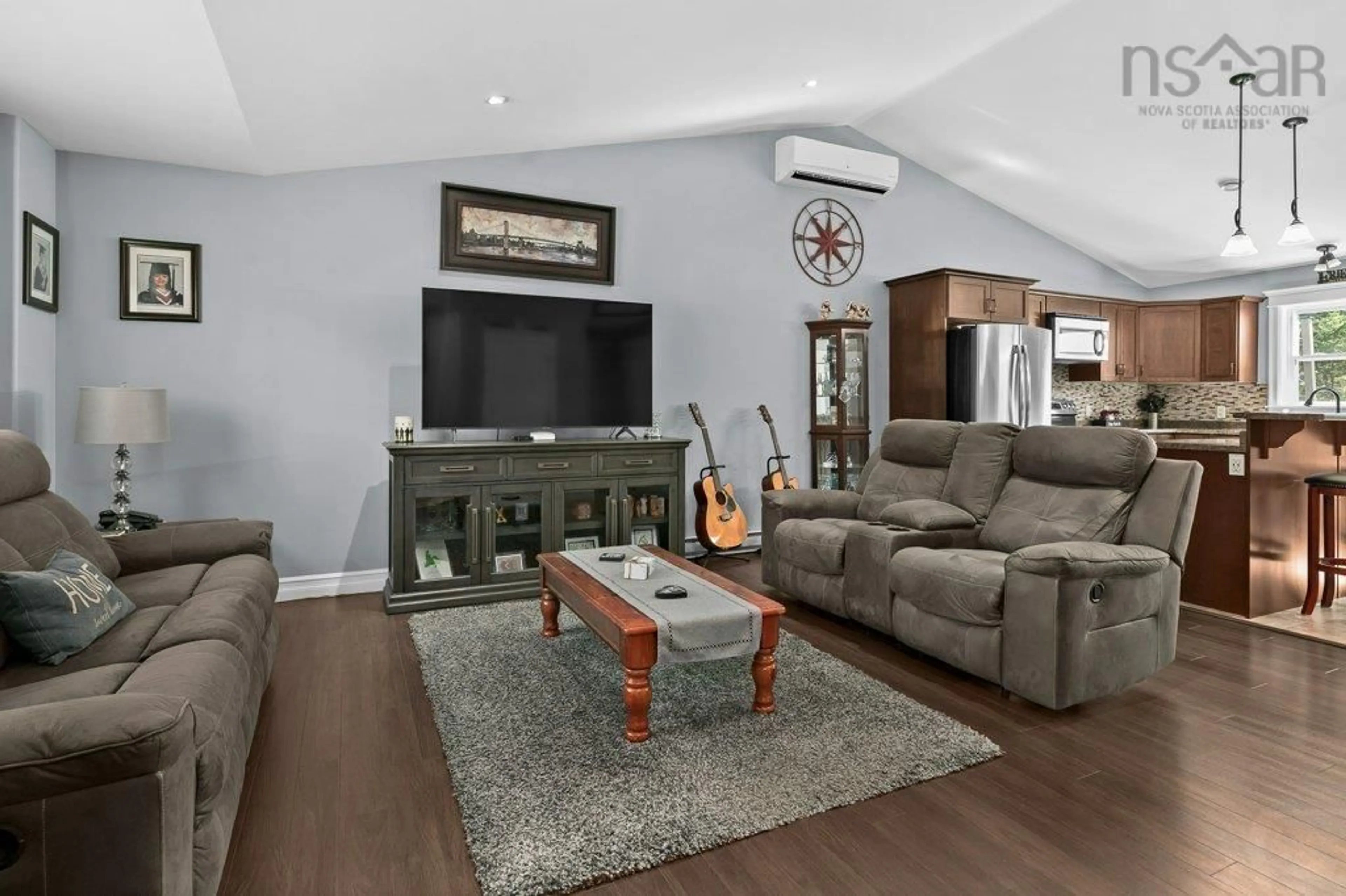 Living room with furniture, wood/laminate floor for 3226 Sackville Dr, Upper Sackville Nova Scotia B4E 3C5