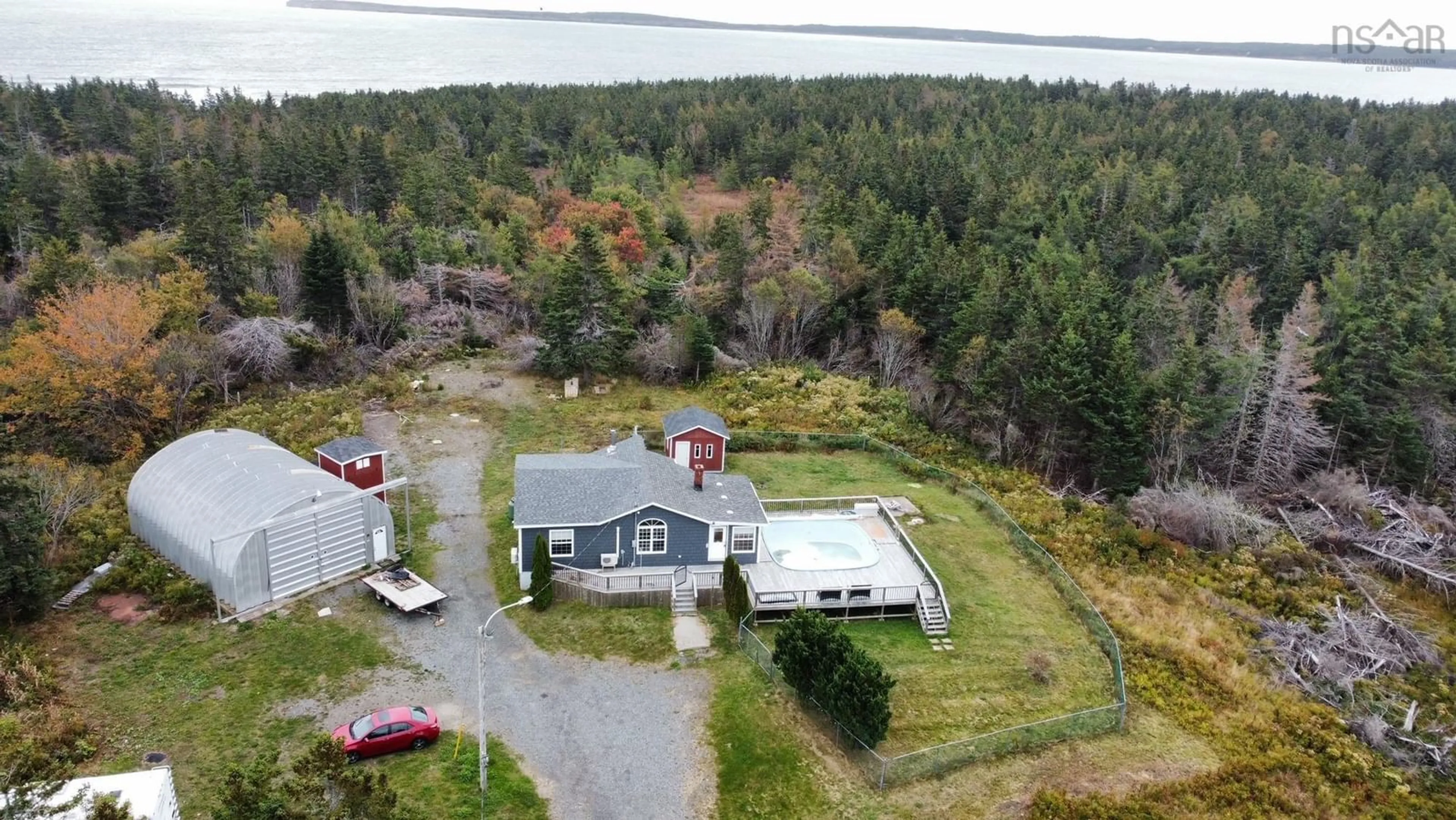 A pic from outside/outdoor area/front of a property/back of a property/a pic from drone, water/lake/river/ocean view for 120 Long Beach Rd, Port Morien Nova Scotia B1B 1E6