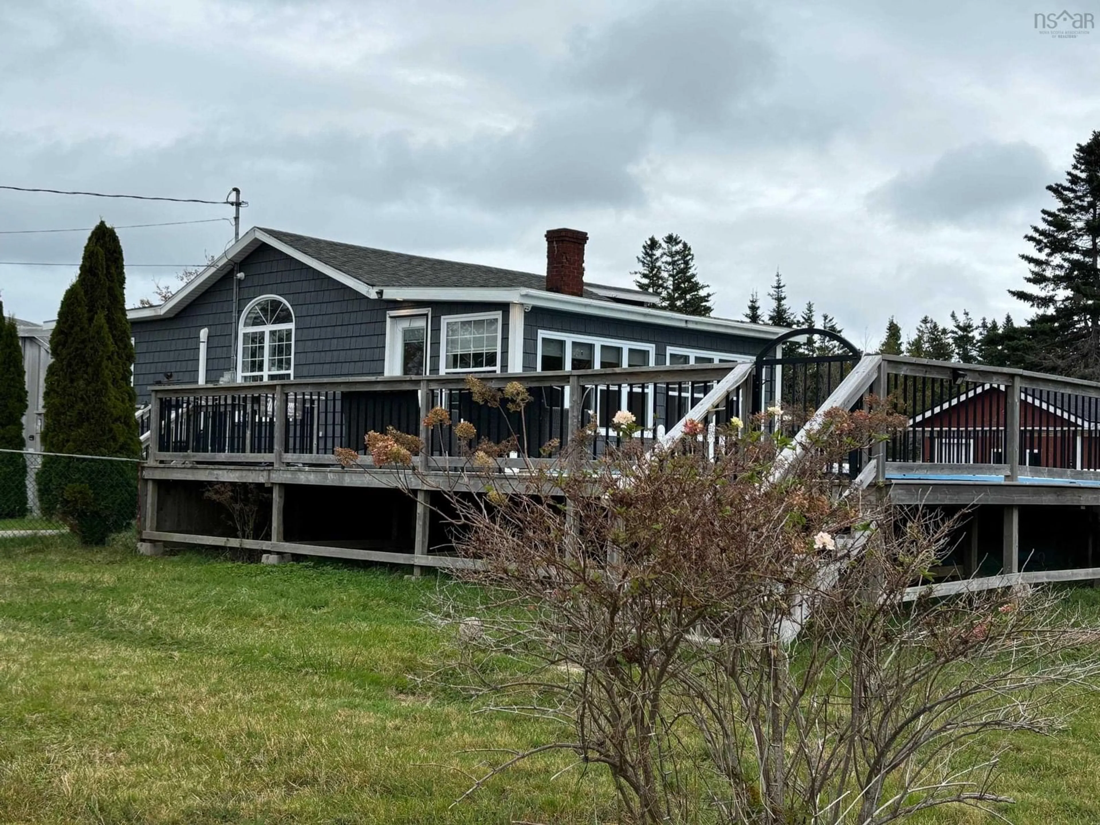 A pic from outside/outdoor area/front of a property/back of a property/a pic from drone, water/lake/river/ocean view for 120 Long Beach Rd, Port Morien Nova Scotia B1B 1E6