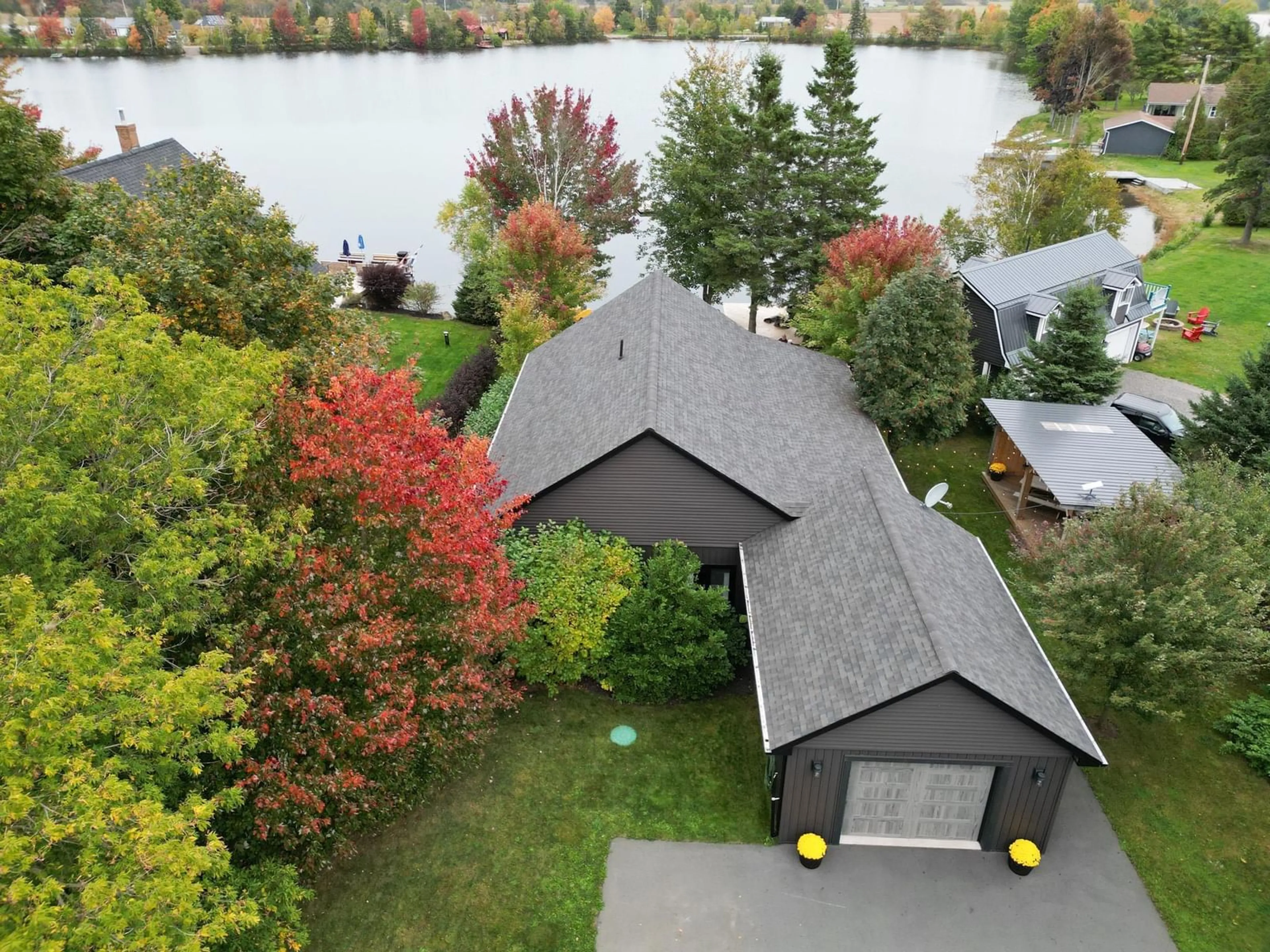 A pic from outside/outdoor area/front of a property/back of a property/a pic from drone, water/lake/river/ocean view for 100 Lake Shore Dr, Great Village Nova Scotia B0M 1L0