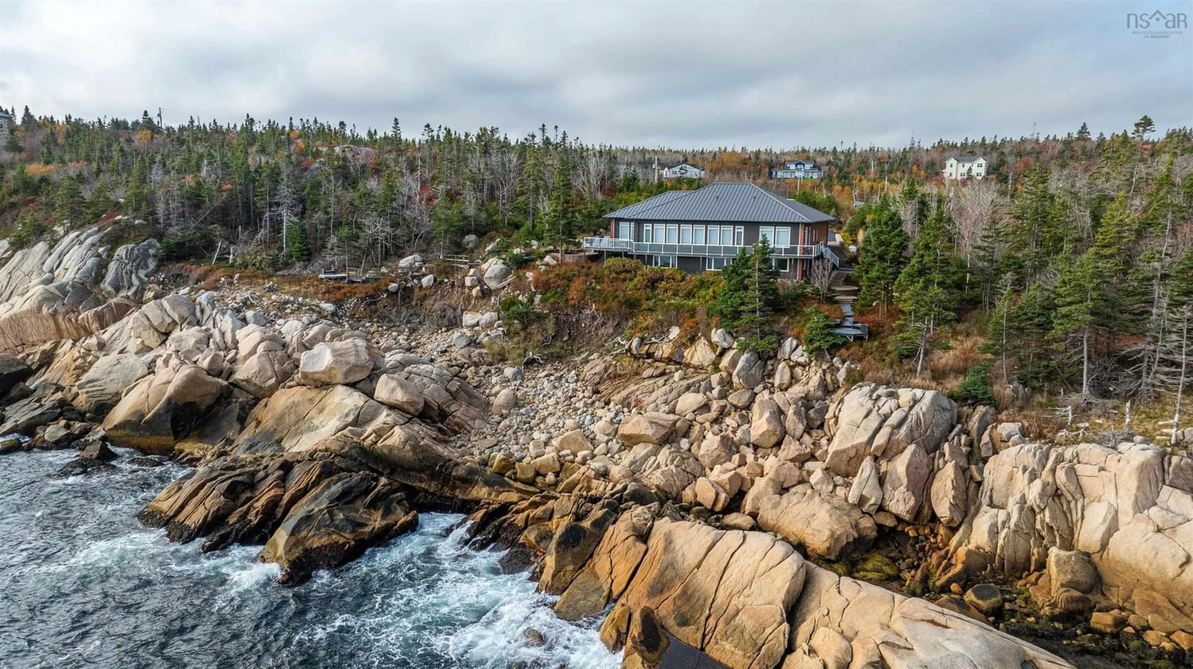 A pic from outside/outdoor area/front of a property/back of a property/a pic from drone, water/lake/river/ocean view for 71 Kittiwake Ridge, Halibut Bay Nova Scotia B3V 1R1