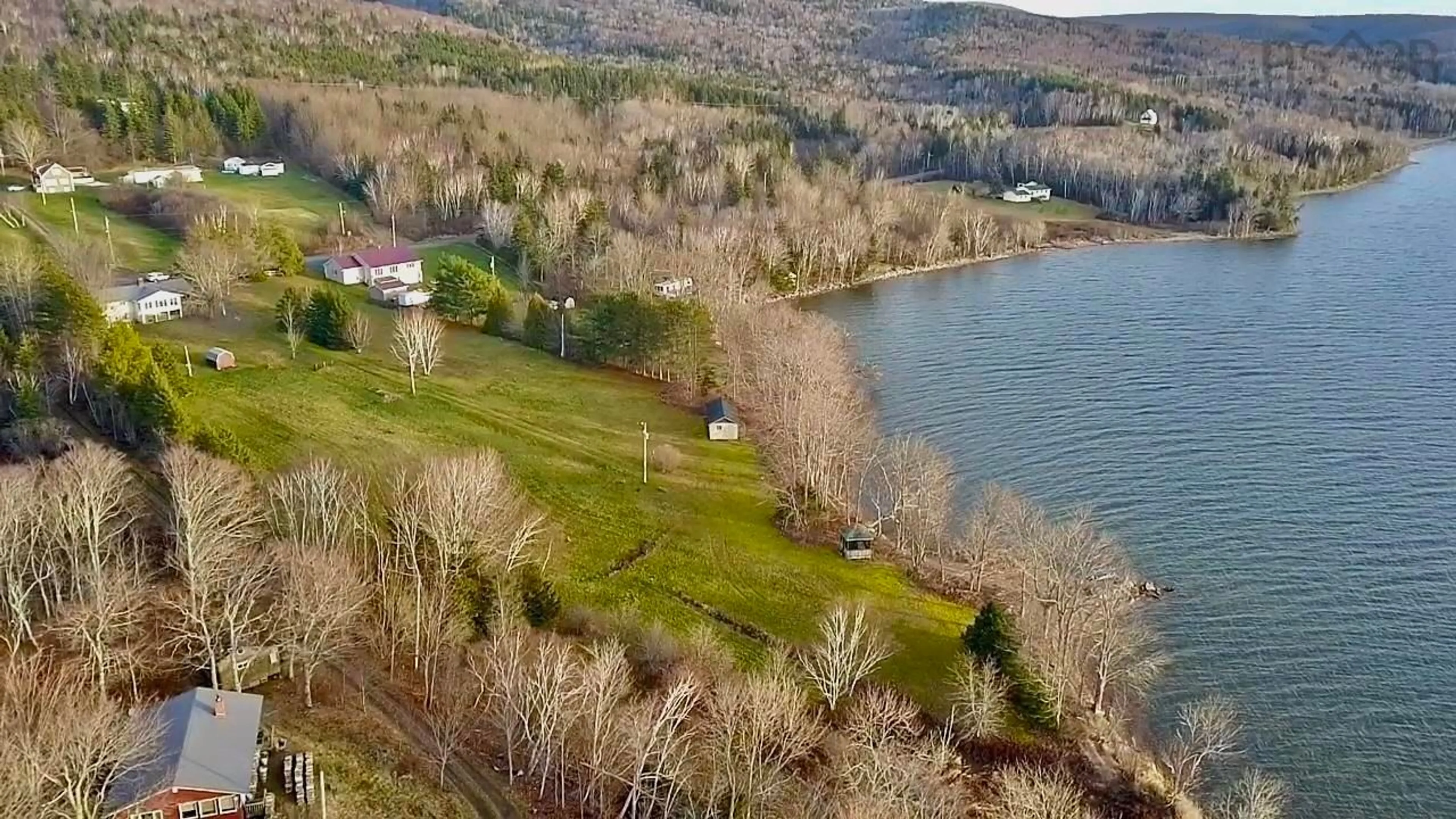 A pic from outside/outdoor area/front of a property/back of a property/a pic from drone, water/lake/river/ocean view for 2957 Highway 395 East Lake Ainslie, East Lake Ainslie Nova Scotia B0E 3M0