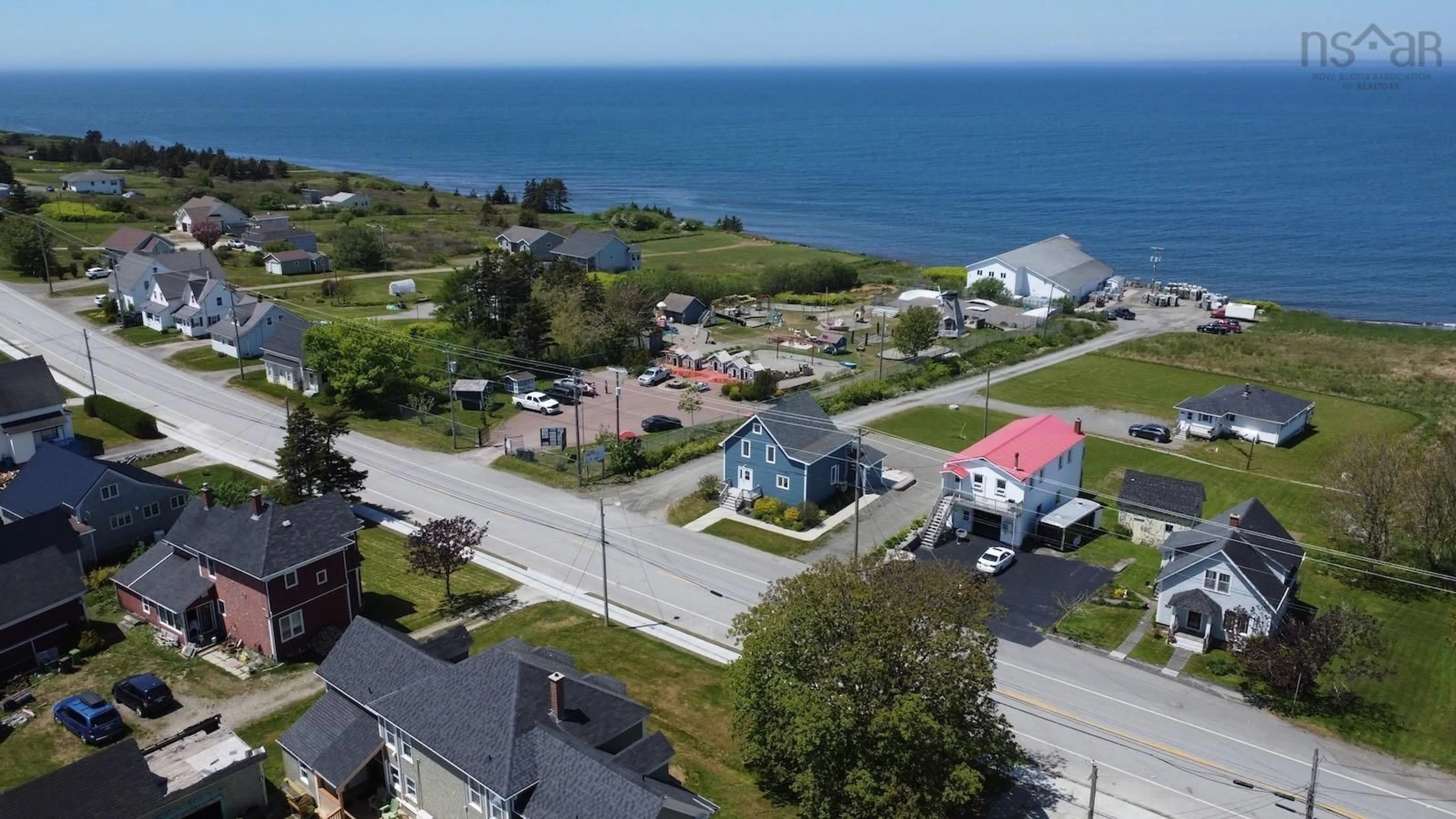 A pic from outside/outdoor area/front of a property/back of a property/a pic from drone, water/lake/river/ocean view for 8149 1 Hwy, Meteghan Centre Nova Scotia B0W 2J0