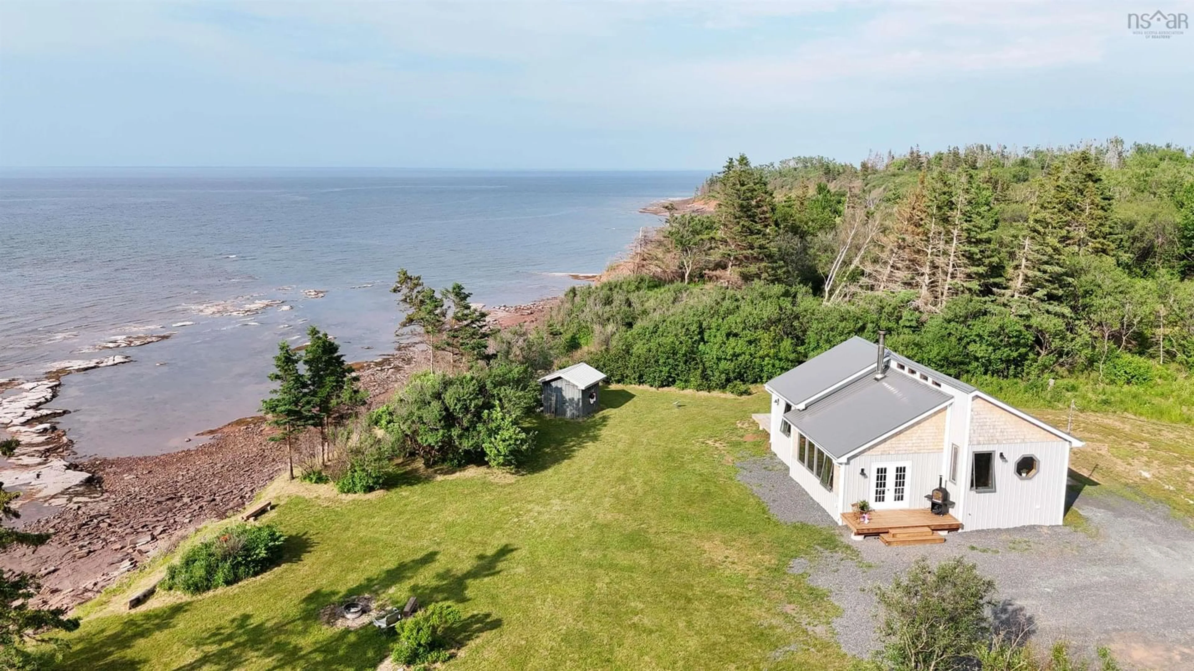 A pic from outside/outdoor area/front of a property/back of a property/a pic from drone, water/lake/river/ocean view for 120 Skinners Cove East Rd, Melville Nova Scotia B0K 1N0