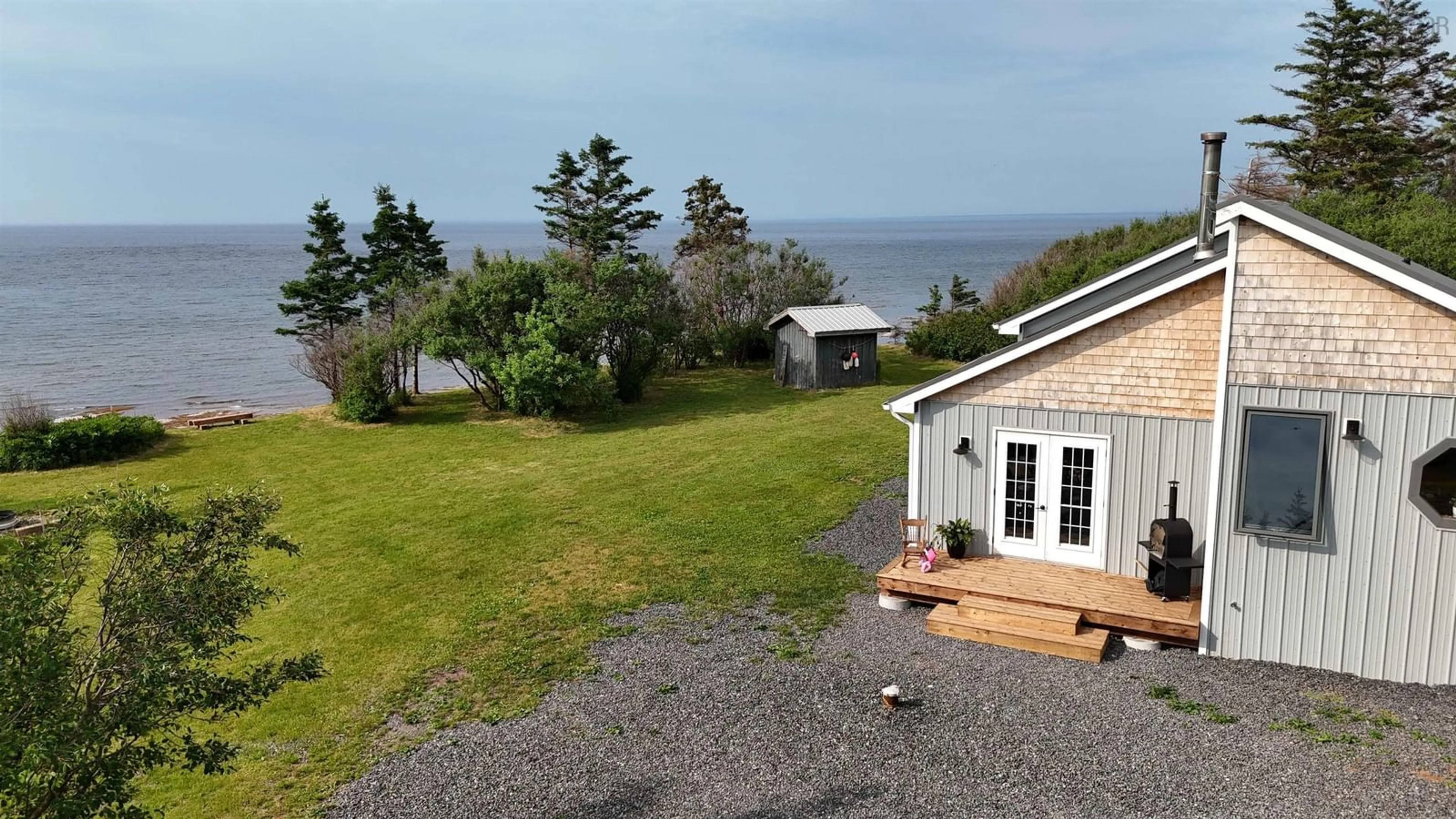 A pic from outside/outdoor area/front of a property/back of a property/a pic from drone, water/lake/river/ocean view for 120 Skinners Cove East Rd, Melville Nova Scotia B0K 1N0