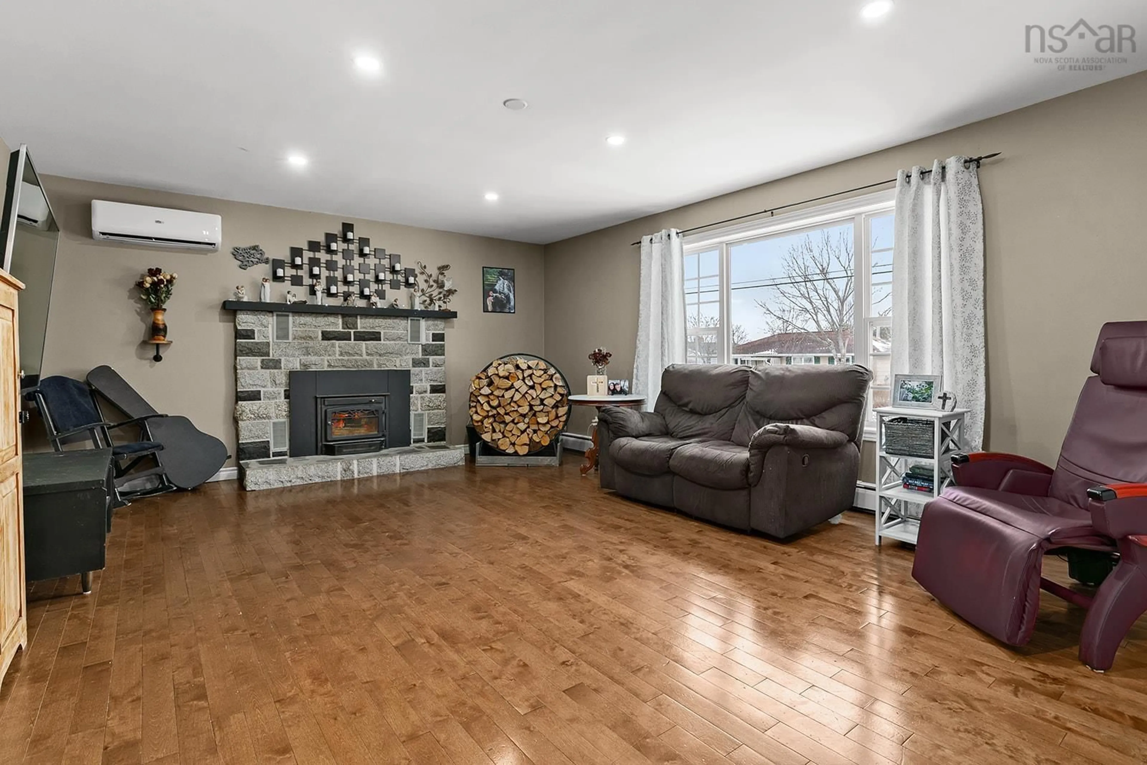 Living room with furniture, wood/laminate floor for 19 Parker Place Cres, Enfield Nova Scotia B2T 1C8