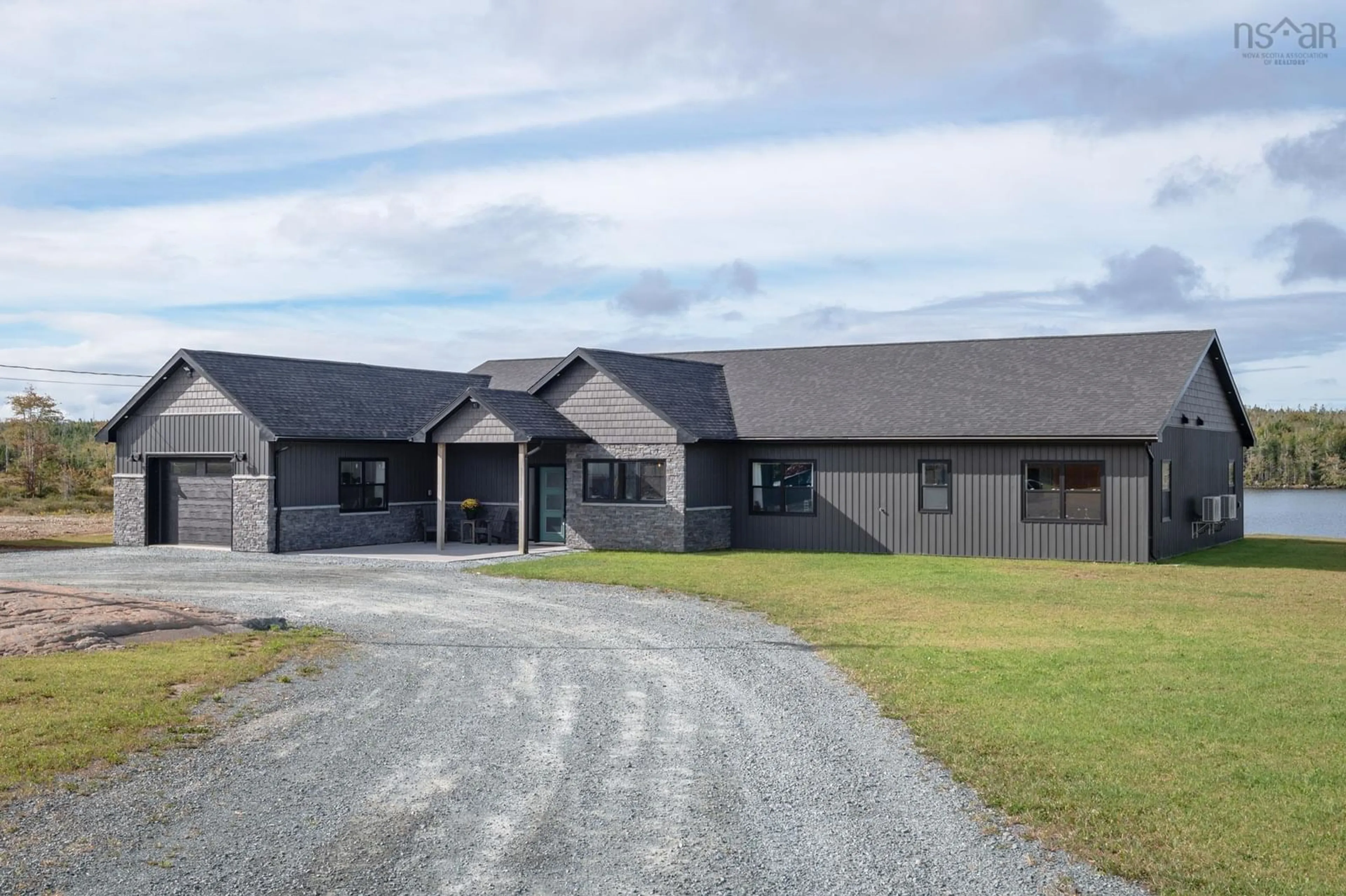 A pic from outside/outdoor area/front of a property/back of a property/a pic from drone, building for 5121 Clam Harbour Rd, Lake Charlotte Nova Scotia B0J 3H0