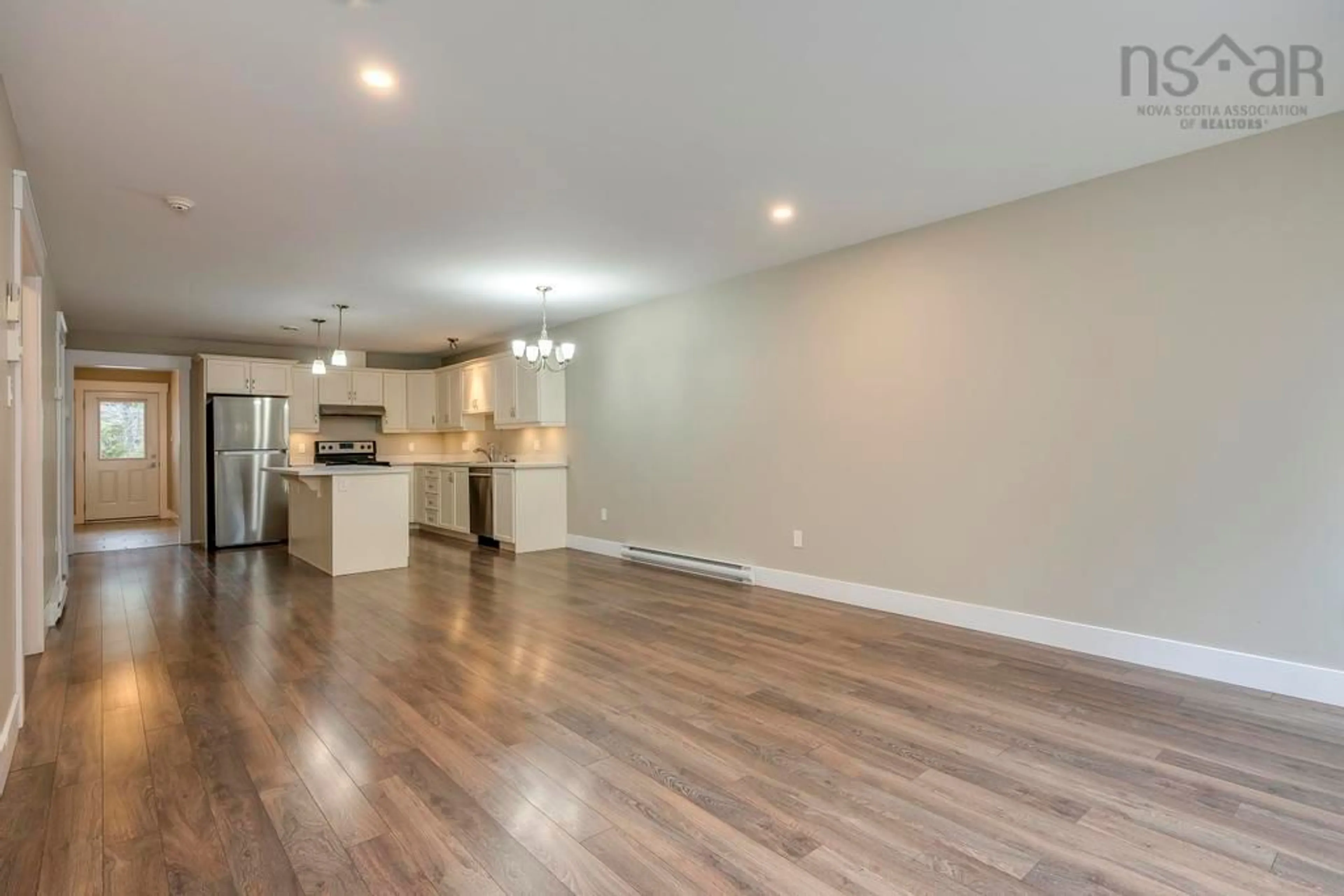 Open concept kitchen, wood/laminate floor for 25 Founders Crt, Porters Lake Nova Scotia B3E 0C1