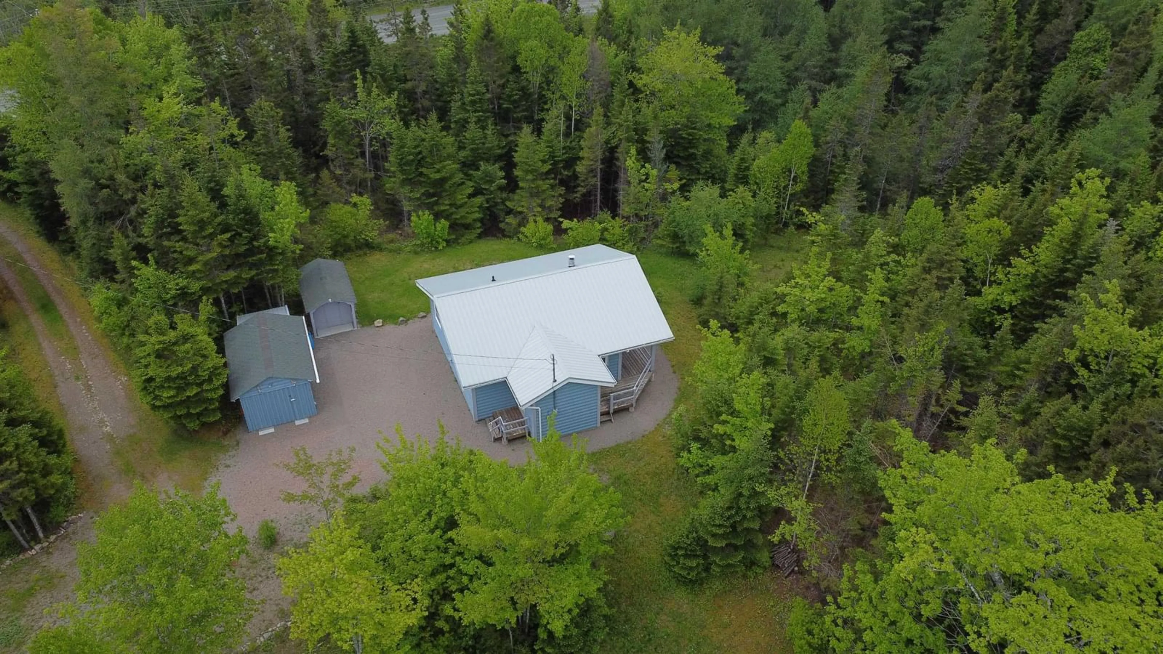 A pic from outside/outdoor area/front of a property/back of a property/a pic from drone, forest/trees view for 109 Cenotaph Rd, Glenora Nova Scotia B0E 3L0