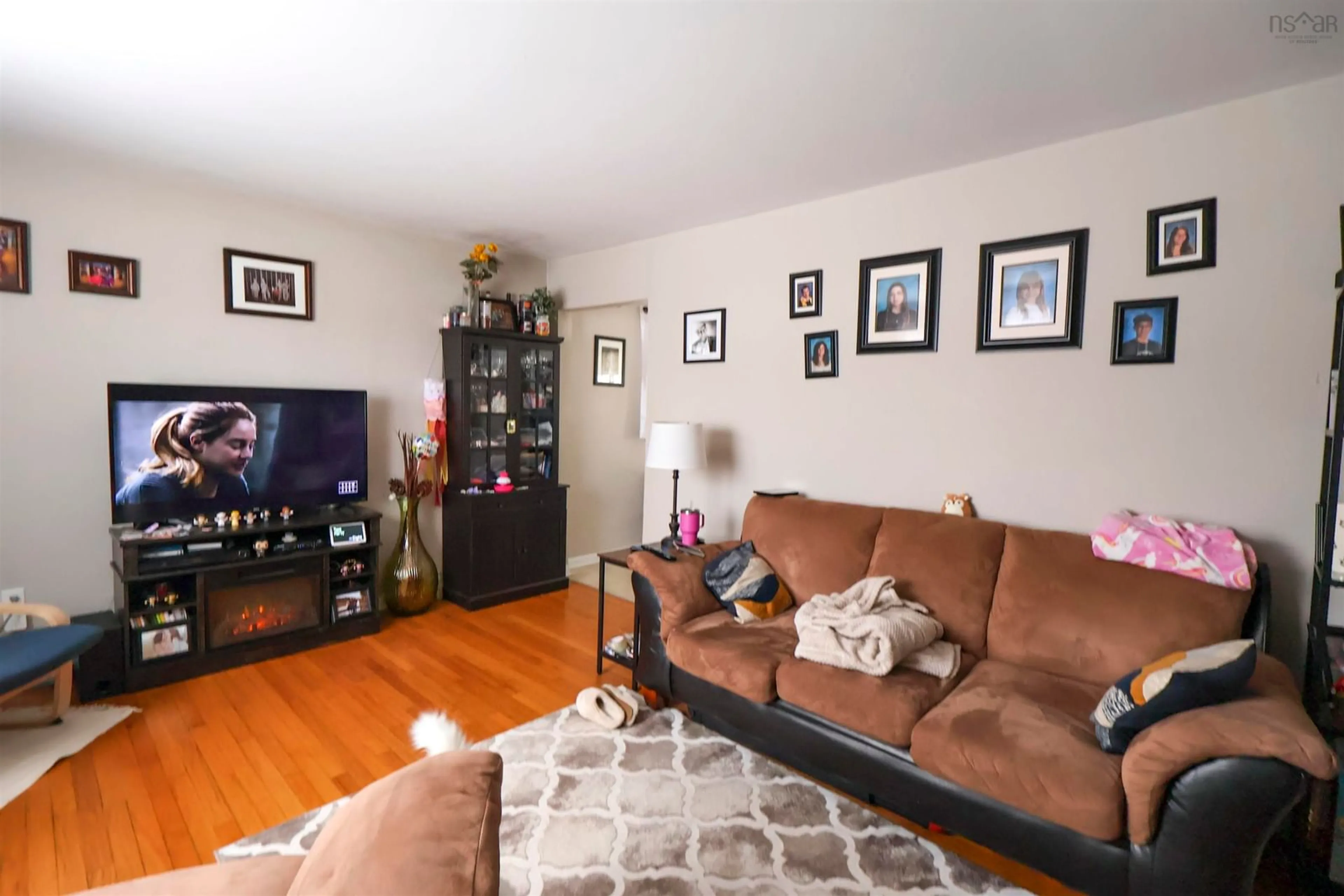 Living room with furniture, wood/laminate floor for 106 School St, Kentville Nova Scotia B4N 2P9