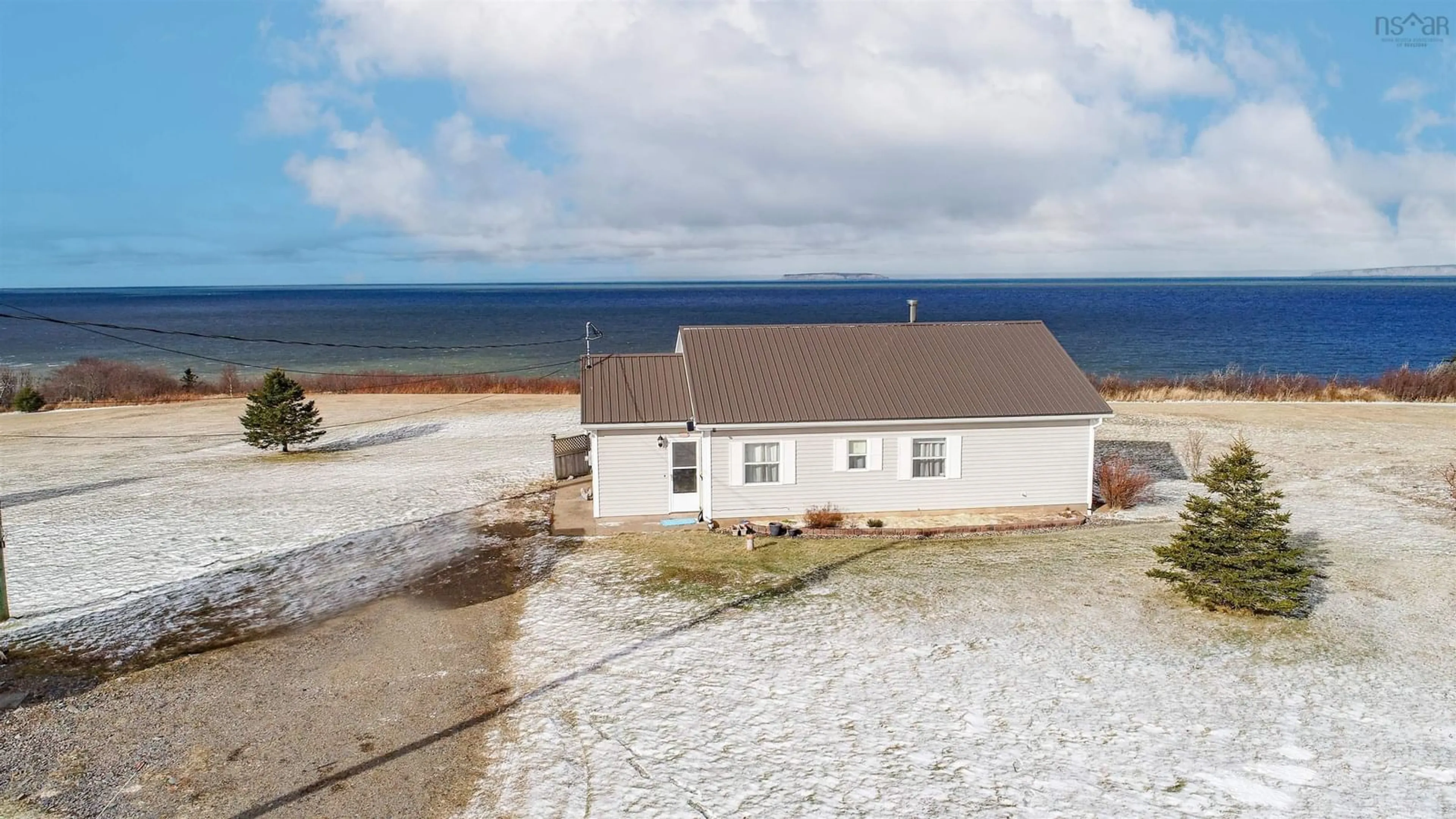 A pic from outside/outdoor area/front of a property/back of a property/a pic from drone, water/lake/river/ocean view for 442 Shore, Ogilvie Nova Scotia B0P 1E0