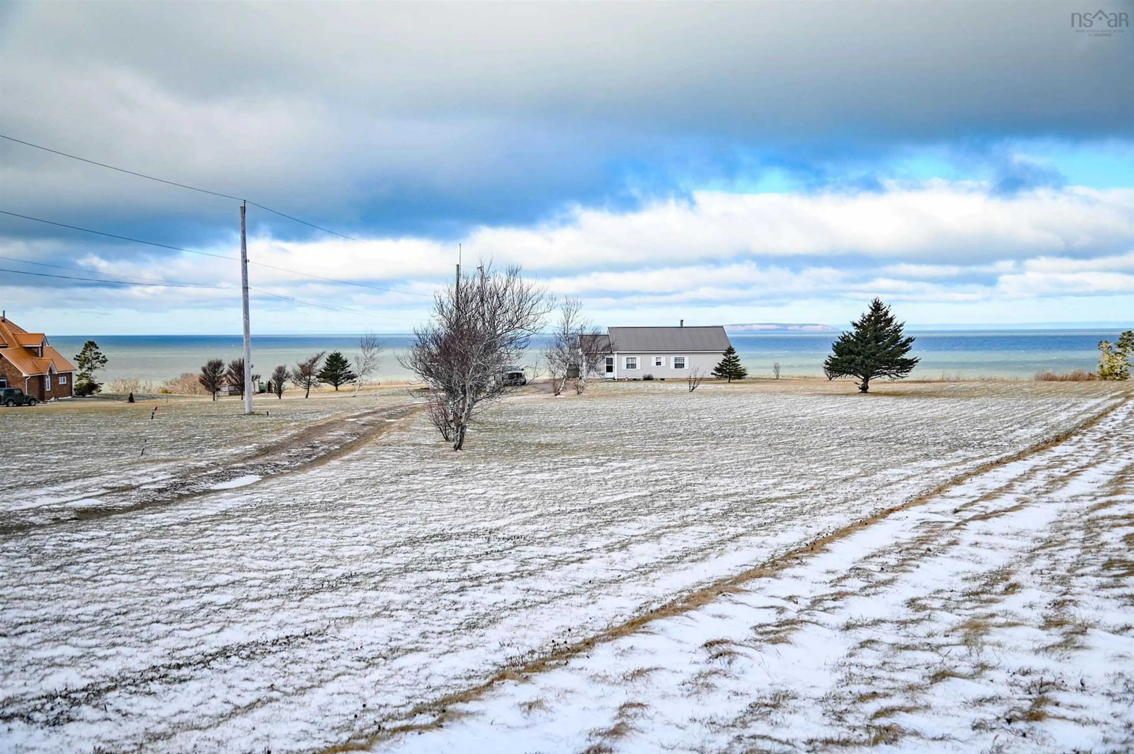 A pic from outside/outdoor area/front of a property/back of a property/a pic from drone, water/lake/river/ocean view for 442 Shore, Ogilvie Nova Scotia B0P 1E0