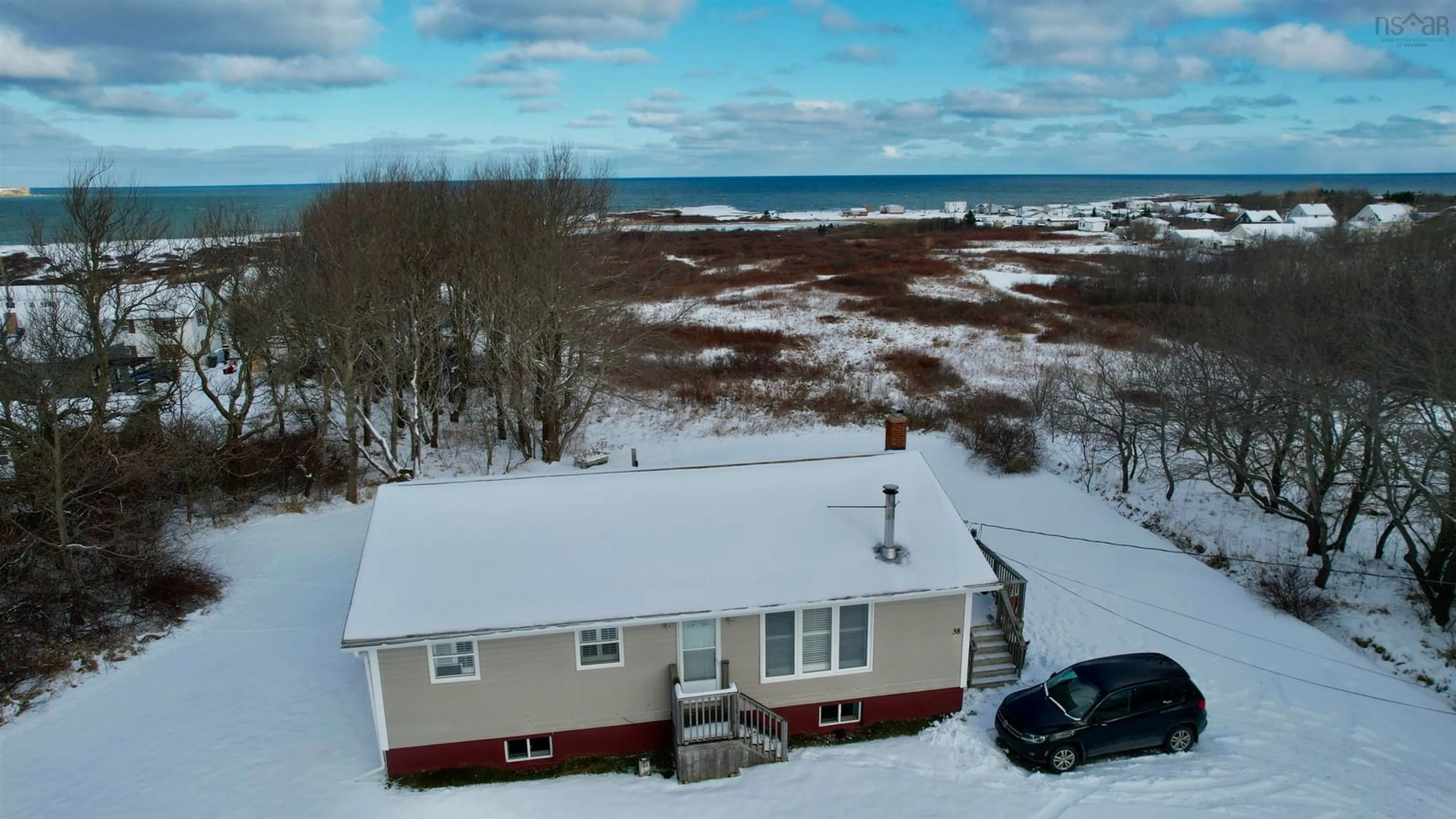 A pic from outside/outdoor area/front of a property/back of a property/a pic from drone, water/lake/river/ocean view for 38 North St, Dominion Nova Scotia B1G 1R2