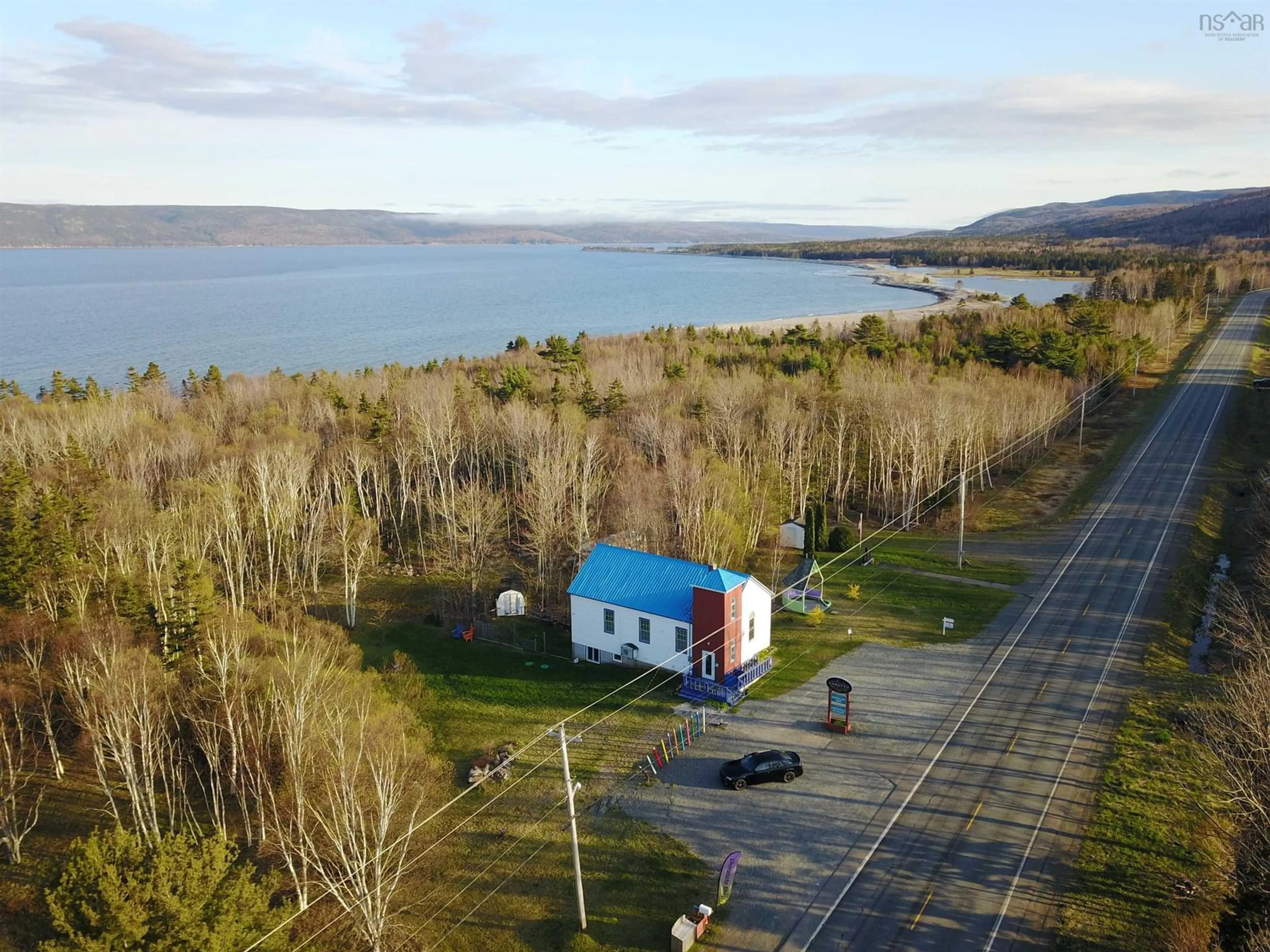 A pic from outside/outdoor area/front of a property/back of a property/a pic from drone, water/lake/river/ocean view for 45943 Cabot Trail, Indian Brook Nova Scotia B0C 1H0