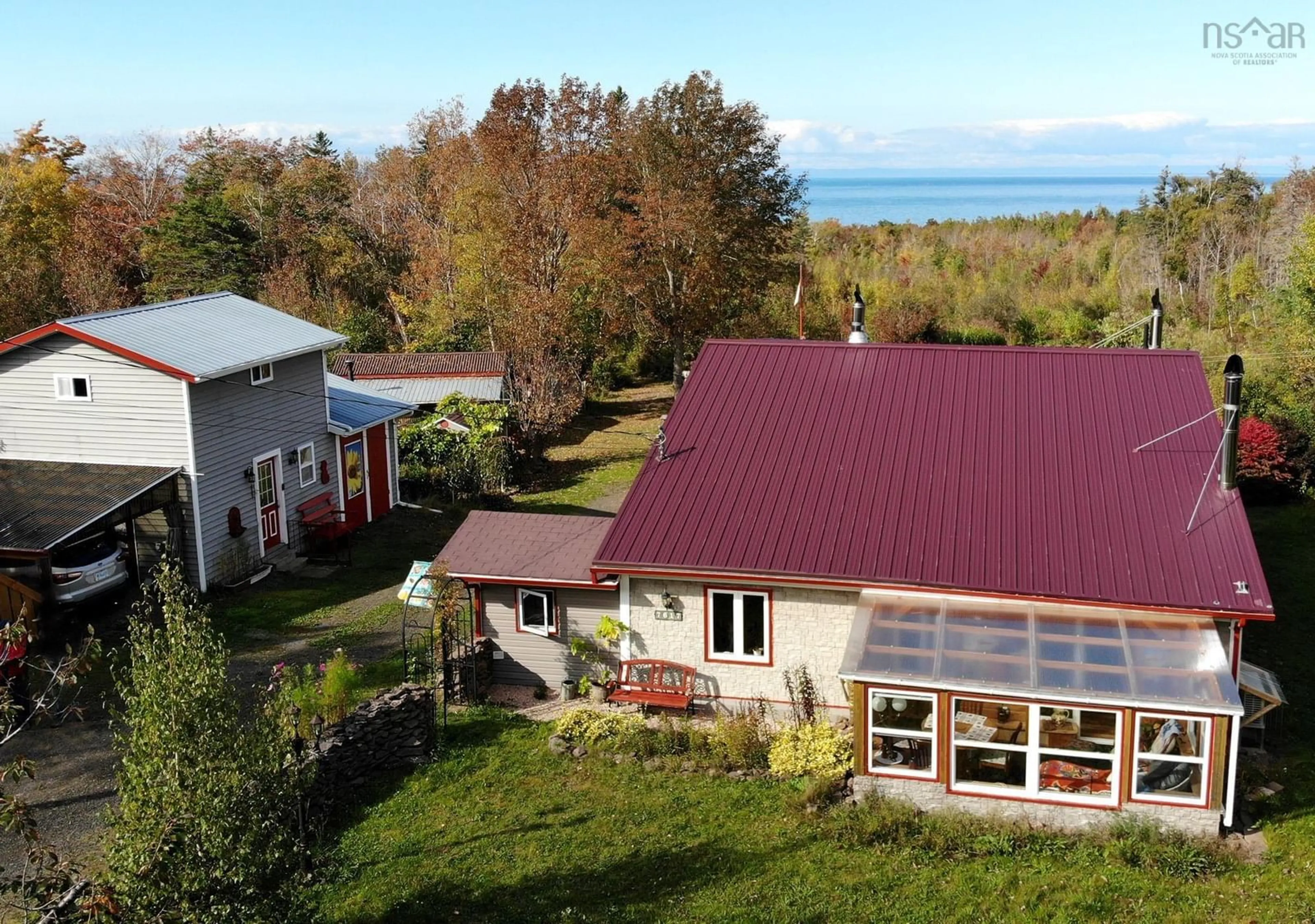 A pic from outside/outdoor area/front of a property/back of a property/a pic from drone, water/lake/river/ocean view for 7617 Shore Rd, Hampton Nova Scotia B0S 1L0