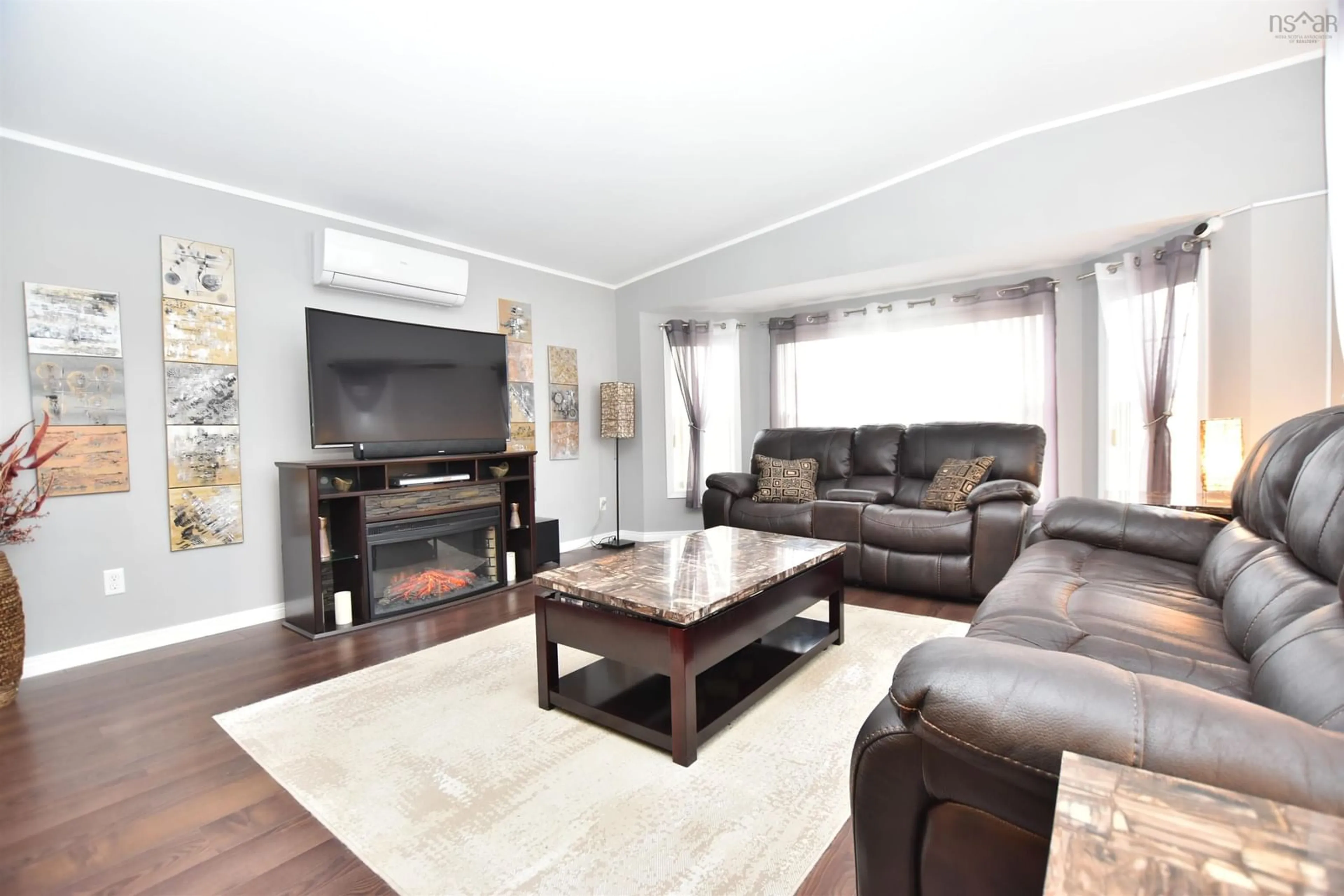 Living room with furniture, wood/laminate floor for 85 Birchill Dr, Eastern Passage Nova Scotia B3G 1C8