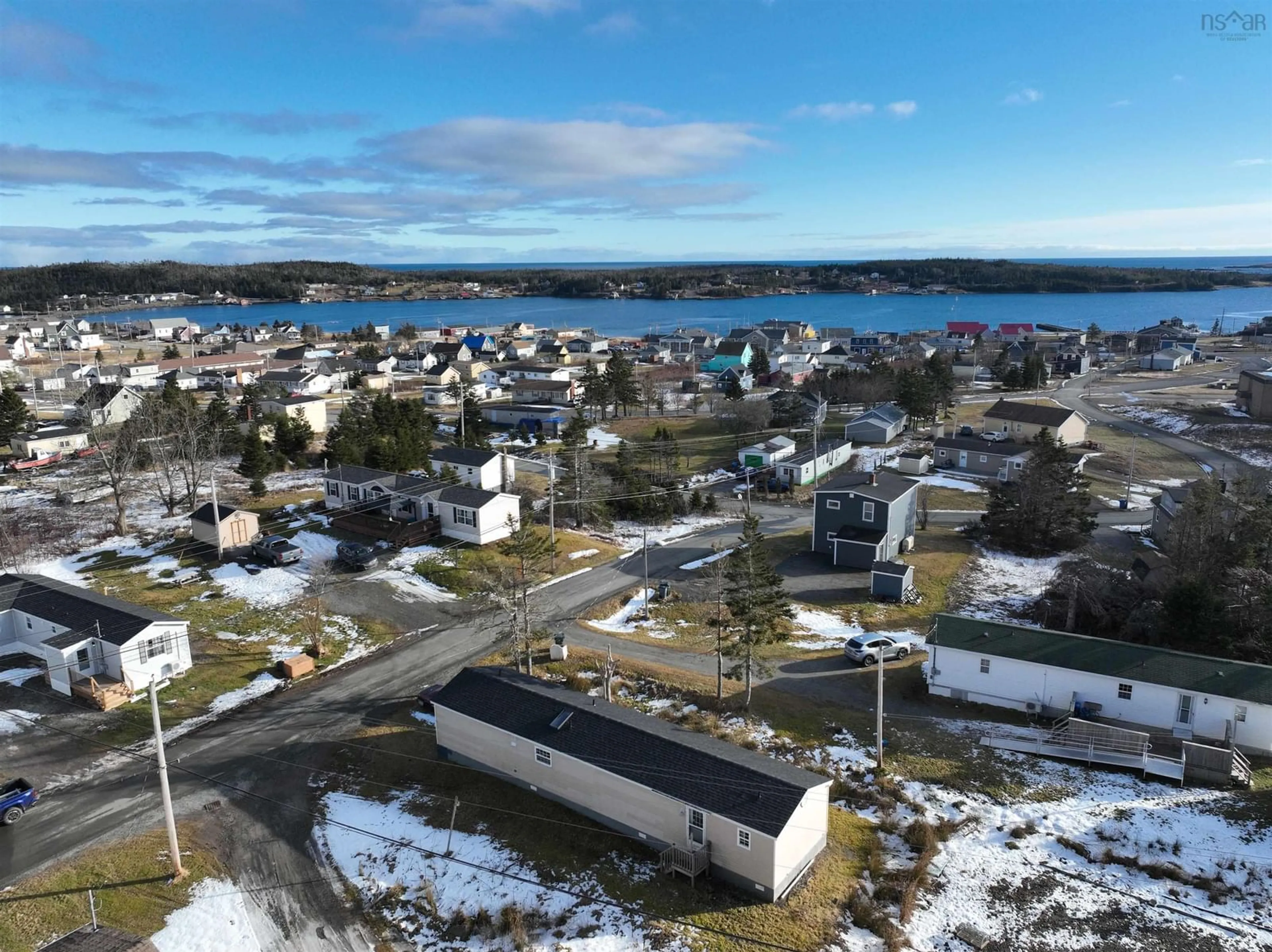 A pic from outside/outdoor area/front of a property/back of a property/a pic from drone, water/lake/river/ocean view for 41 Kent St, Louisbourg Nova Scotia B1C 1G2