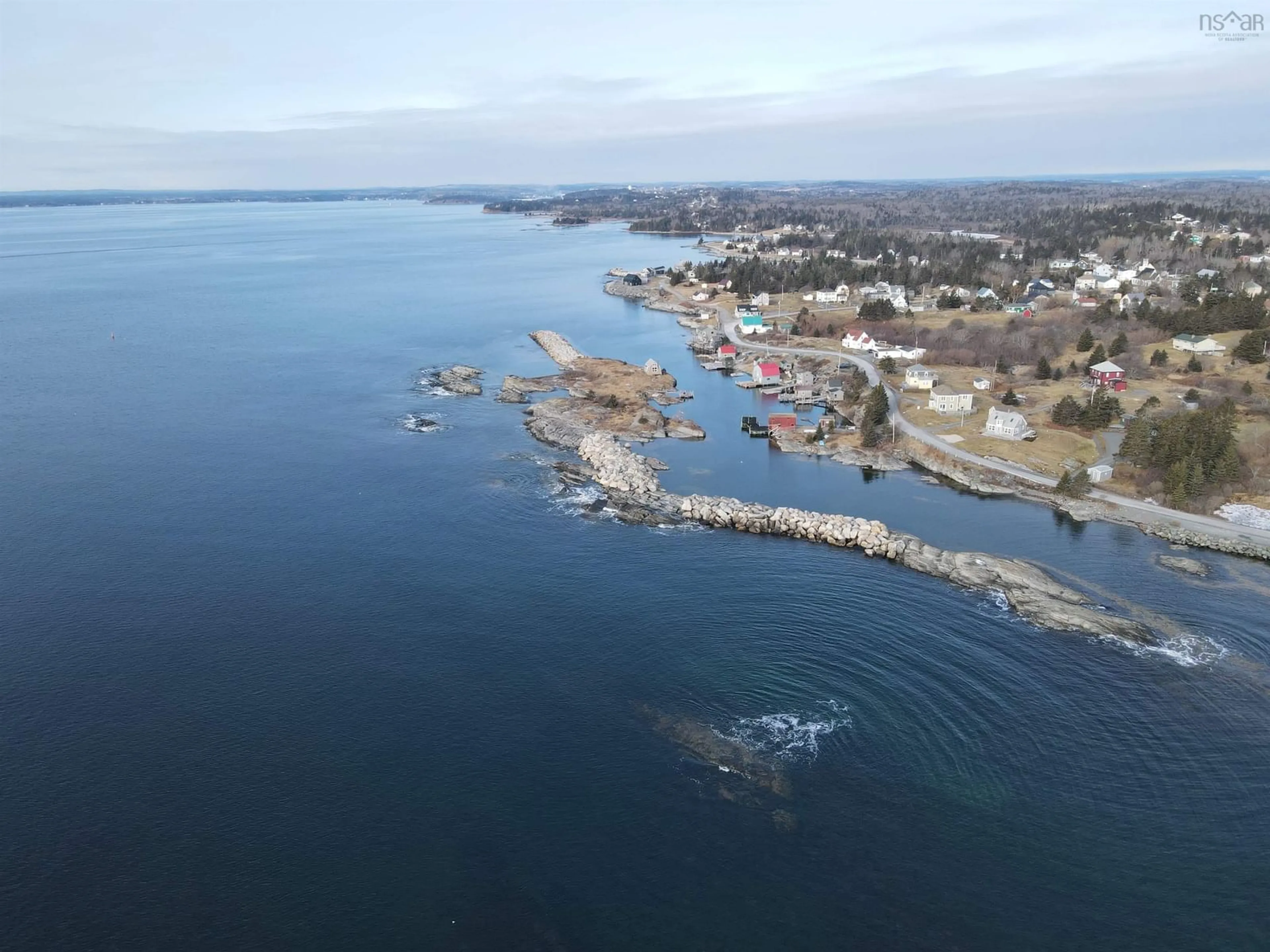 A pic from outside/outdoor area/front of a property/back of a property/a pic from drone, water/lake/river/ocean view for 91 The Point Rd, Blue Rocks Nova Scotia B0J 2C0