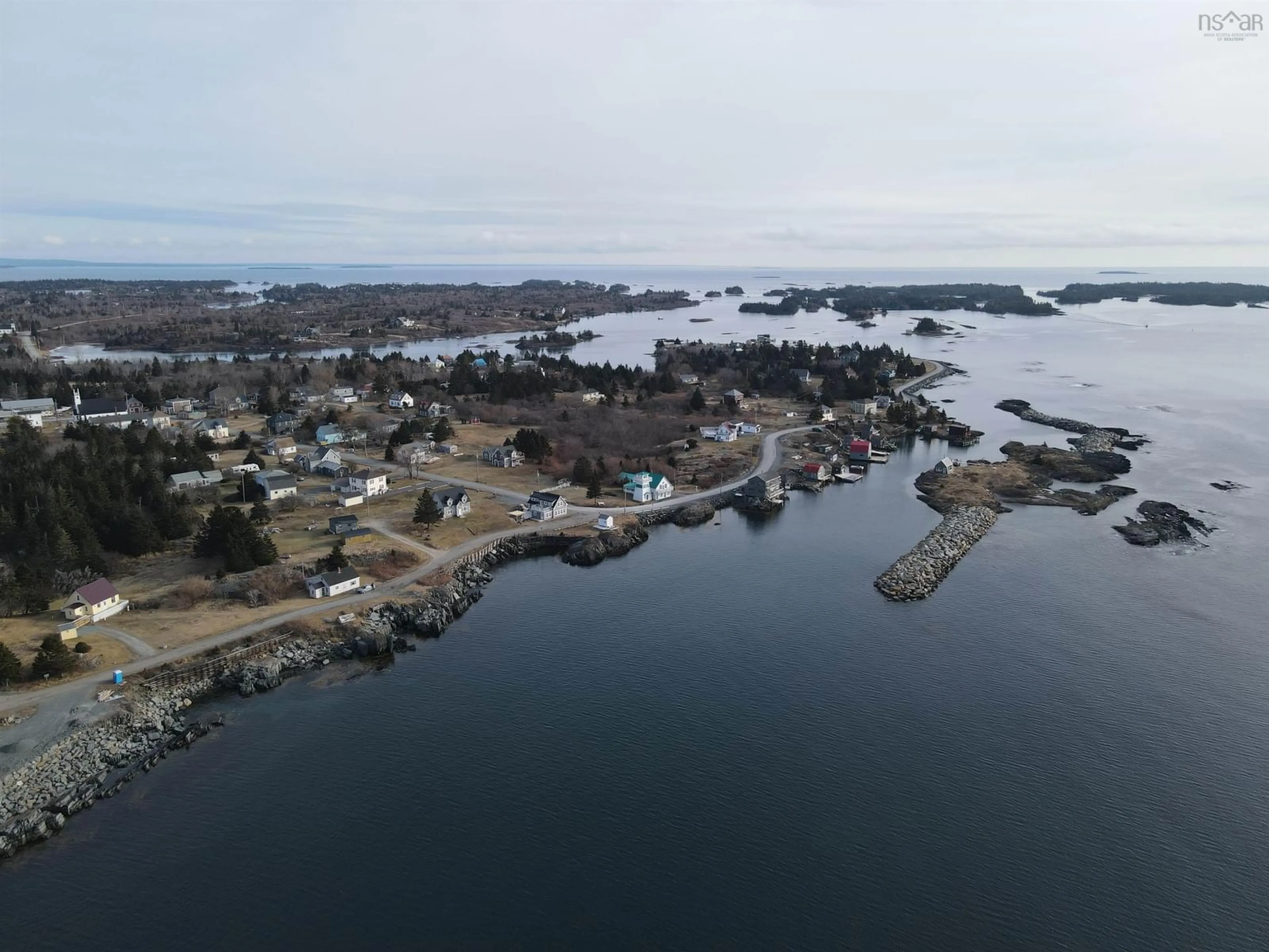 A pic from outside/outdoor area/front of a property/back of a property/a pic from drone, water/lake/river/ocean view for 91 The Point Rd, Blue Rocks Nova Scotia B0J 2C0