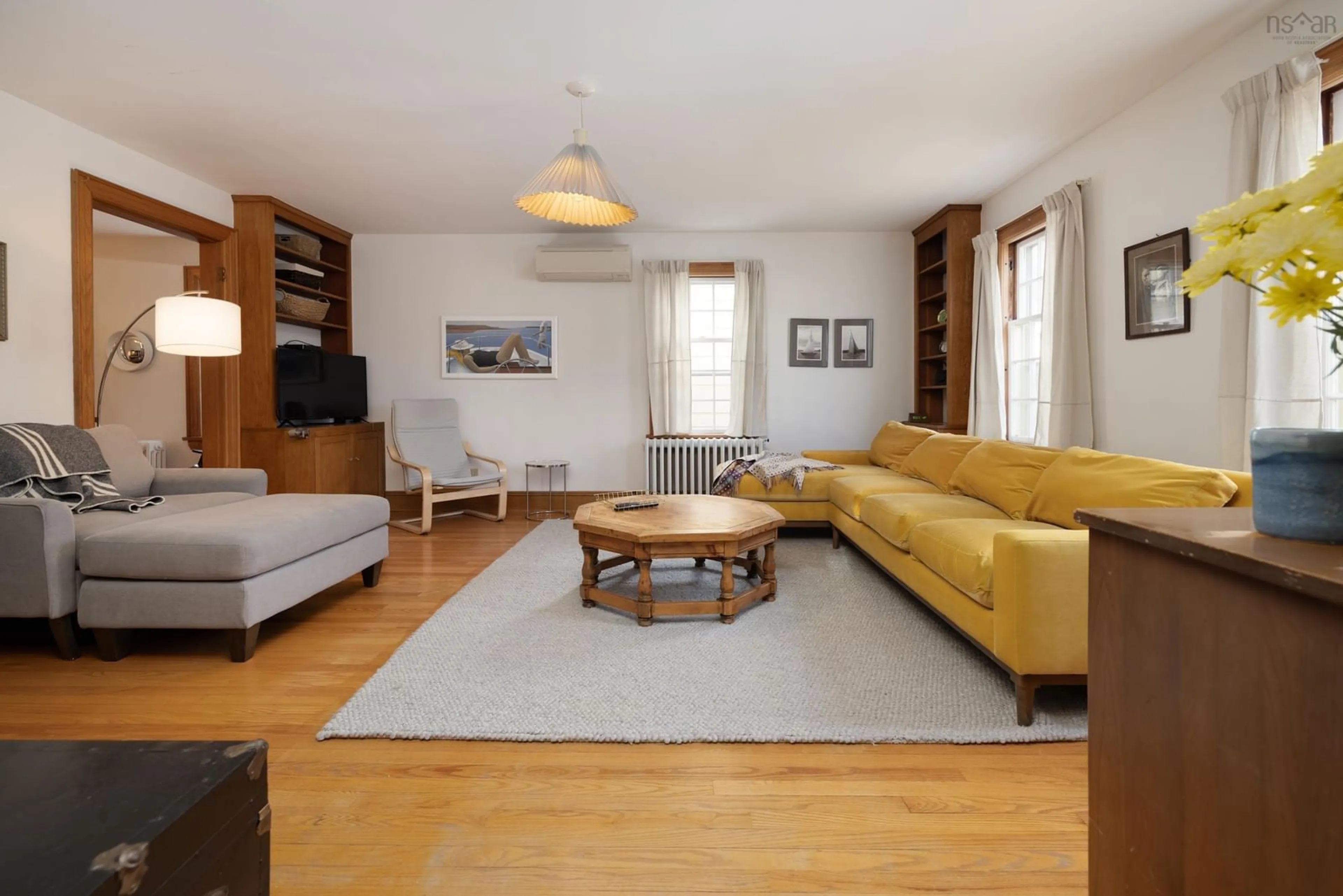 Living room with furniture, wood/laminate floor for 1623 Cambridge St, Halifax Nova Scotia B3H 4A5