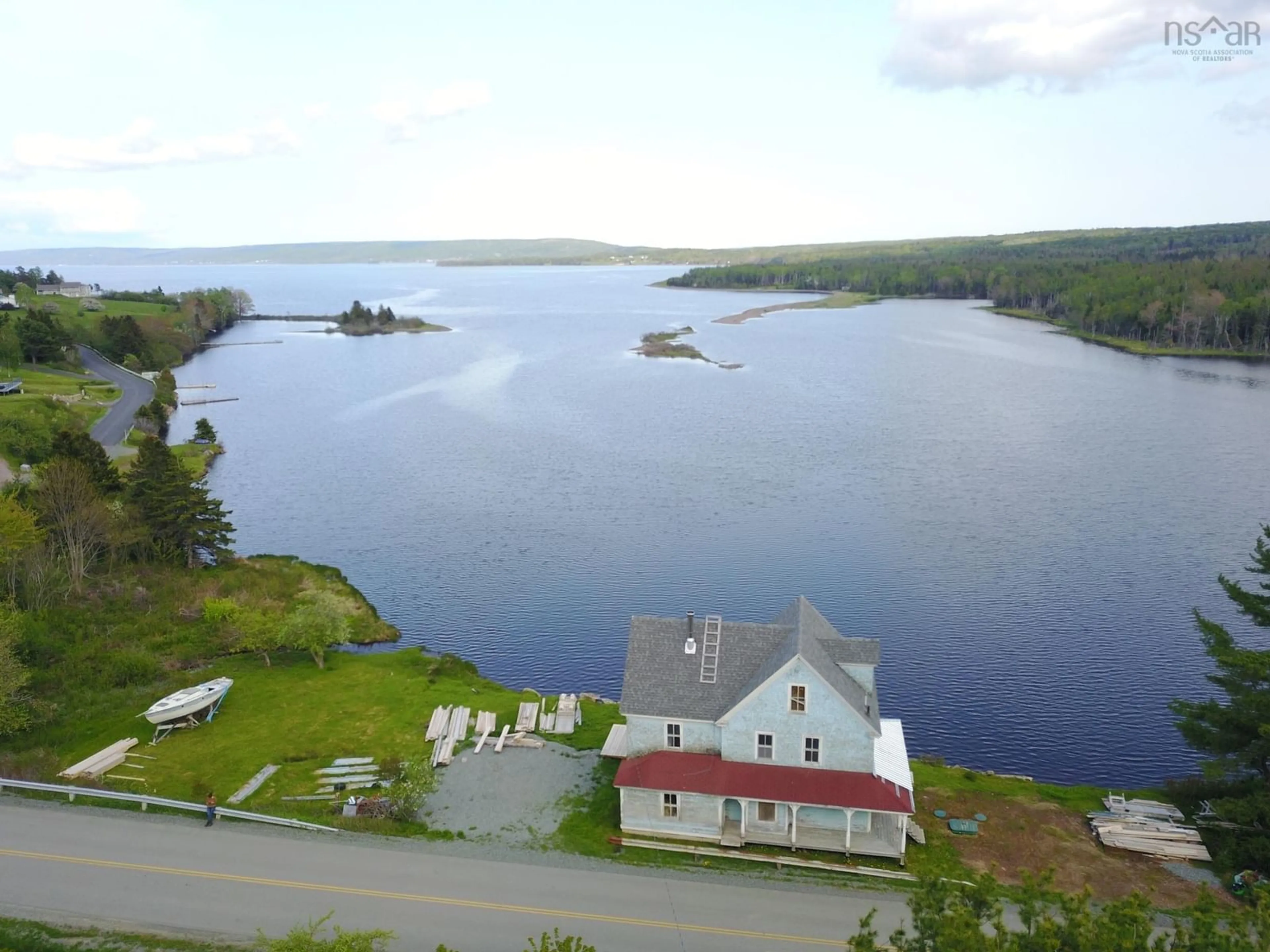 A pic from outside/outdoor area/front of a property/back of a property/a pic from drone, water/lake/river/ocean view for 2160 Marble Mountain Rd, West Bay Nova Scotia B0E 3K0