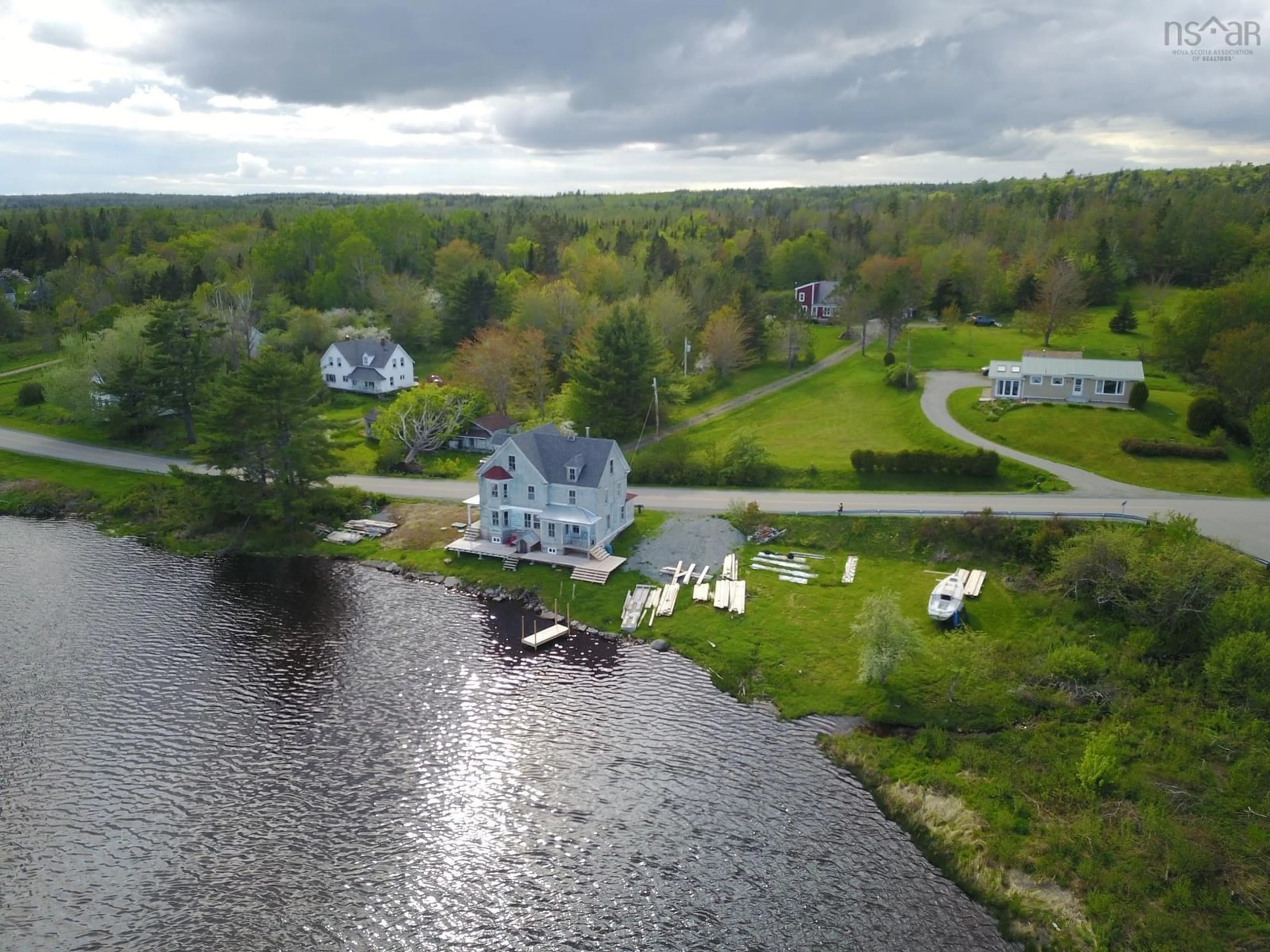 A pic from outside/outdoor area/front of a property/back of a property/a pic from drone, water/lake/river/ocean view for 2160 Marble Mountain Rd, West Bay Nova Scotia B0E 3K0