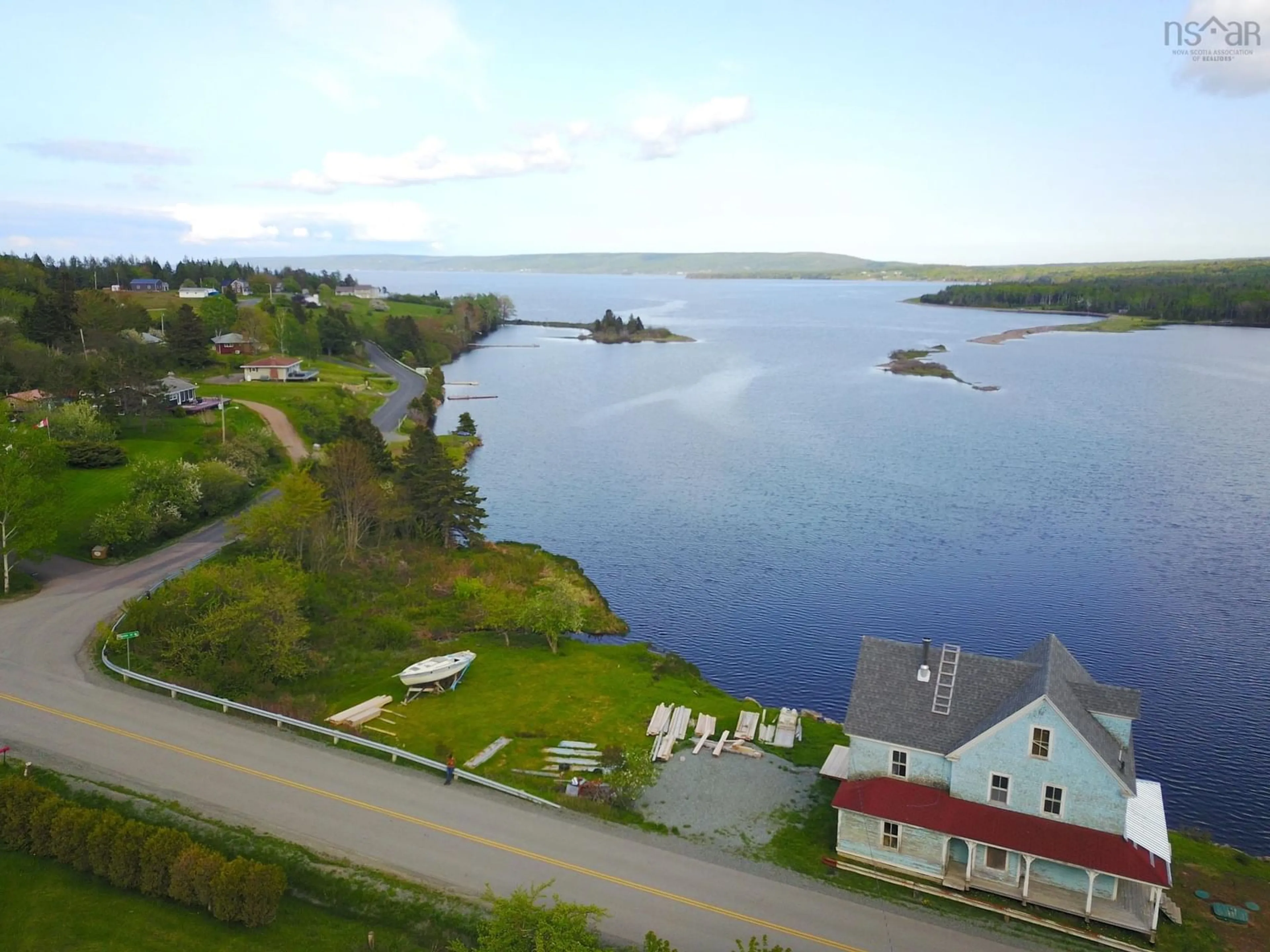 A pic from outside/outdoor area/front of a property/back of a property/a pic from drone, water/lake/river/ocean view for 2160 Marble Mountain Rd, West Bay Nova Scotia B0E 3K0