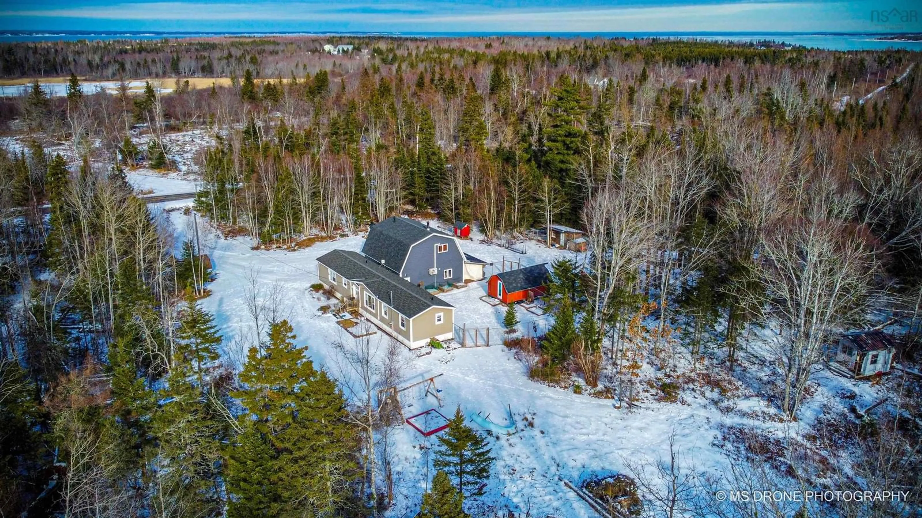 A pic from outside/outdoor area/front of a property/back of a property/a pic from drone, water/lake/river/ocean view for 120 Brule Shore Rd, Barrachois Nova Scotia B0K 1V0