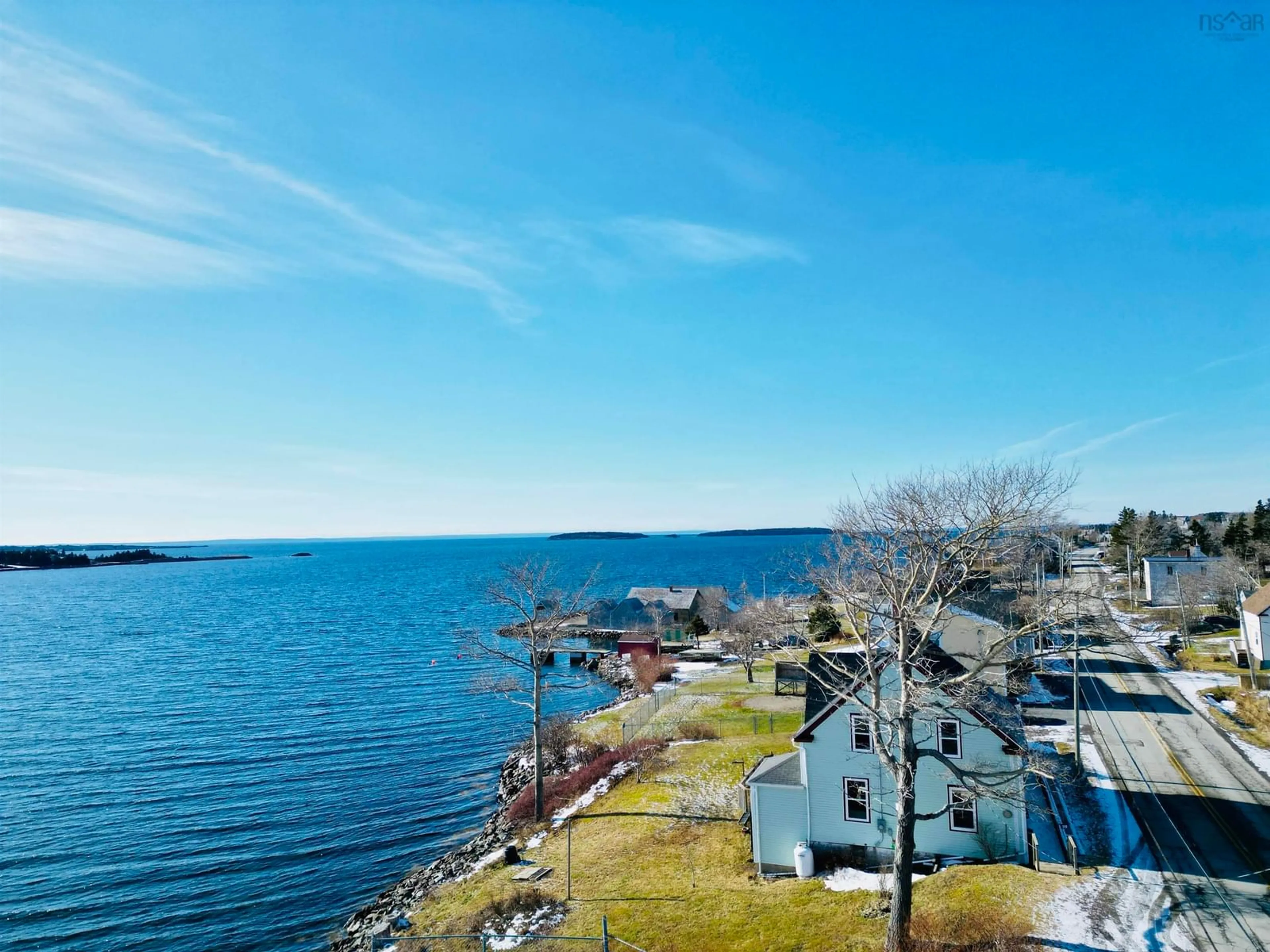 A pic from outside/outdoor area/front of a property/back of a property/a pic from drone, water/lake/river/ocean view for 740 Veterans Memorial Dr, Arichat Nova Scotia B0E 1A0