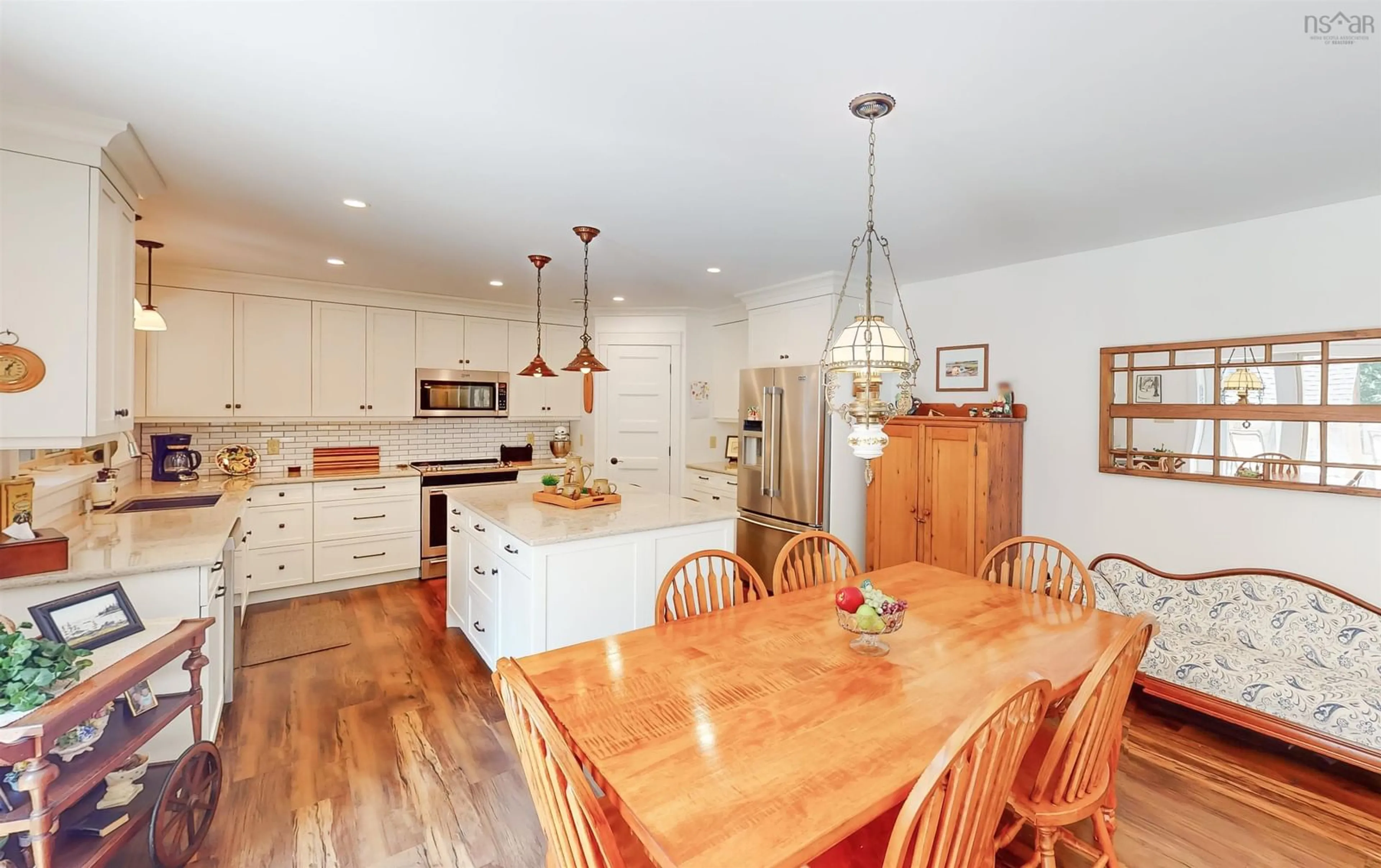 Open concept kitchen, wood/laminate floor for 73 Acadia Dr, Kentville Nova Scotia B4N 5E1