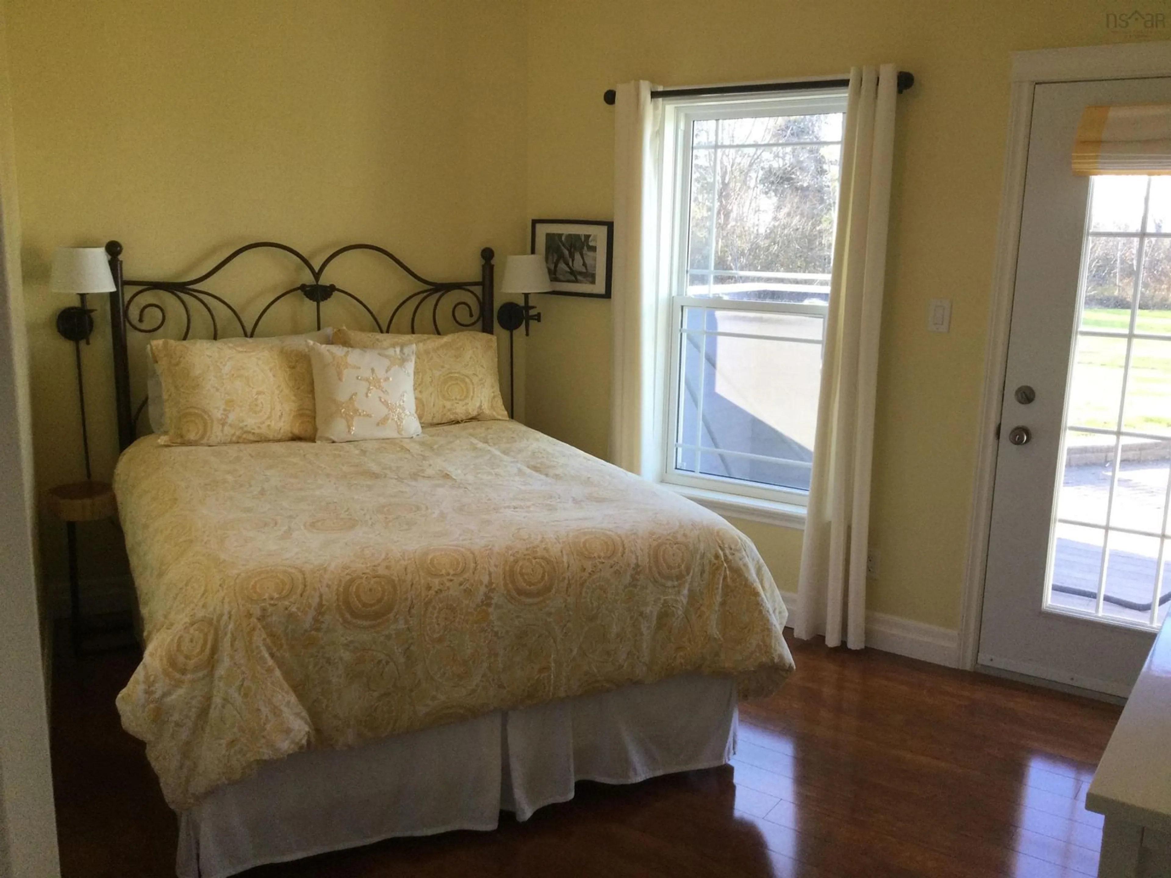 Bedroom with bed, wood/laminate floor for 7914 East Bay Hwy, Big Pond Nova Scotia B1J 1Z5