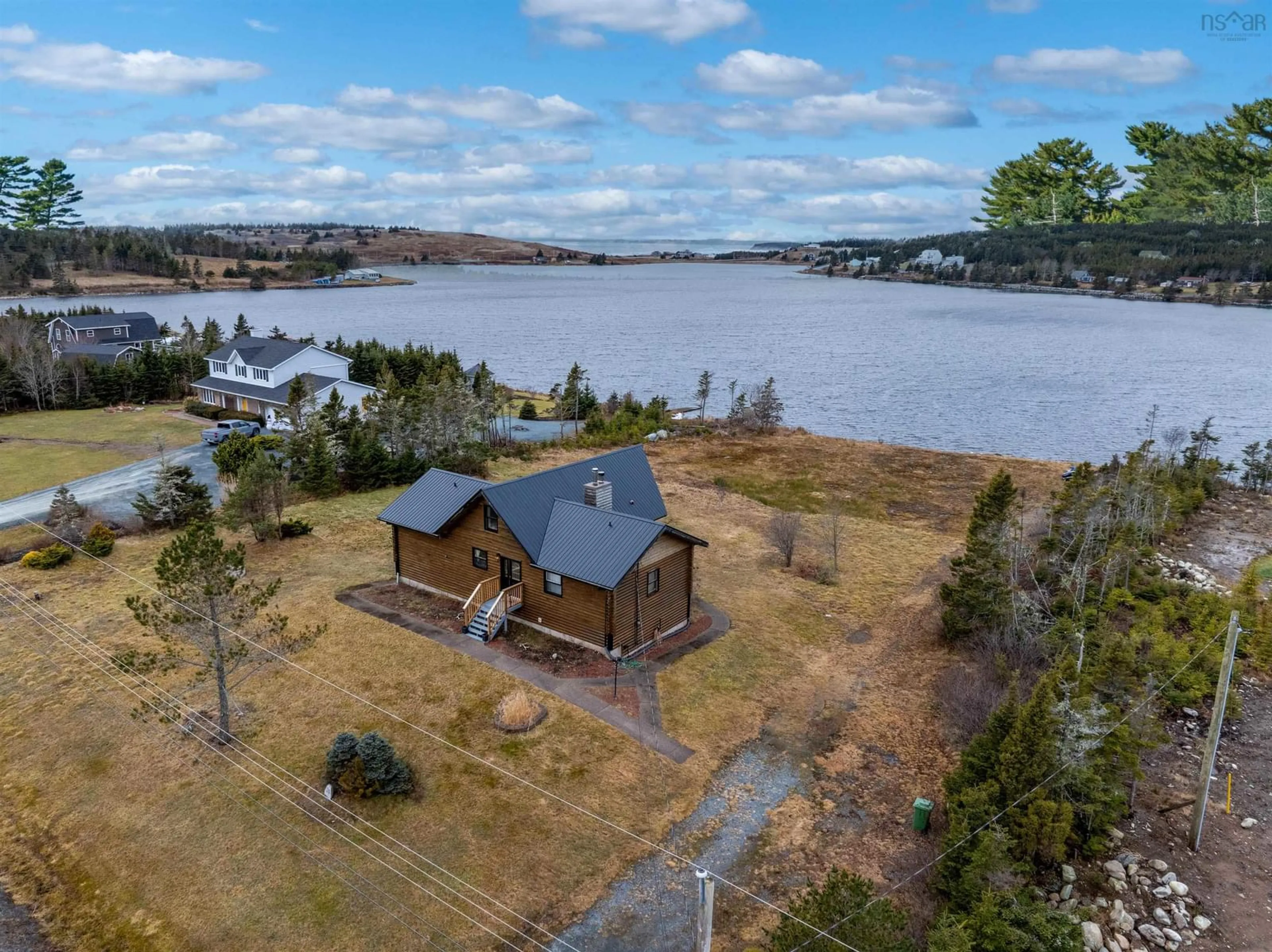 A pic from outside/outdoor area/front of a property/back of a property/a pic from drone, water/lake/river/ocean view for 20 Emerald Dr, Three Fathom Harbour Nova Scotia B0J 2L0