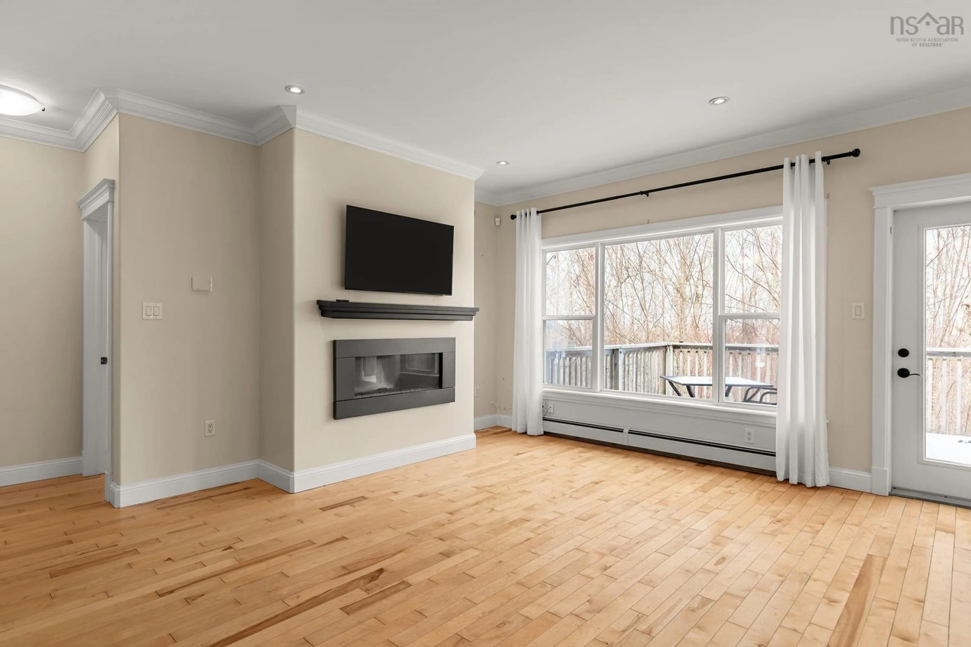 Living room with furniture, wood/laminate floor for 77 Carnoustie Dr, Hammonds Plains Nova Scotia B4B 0E5