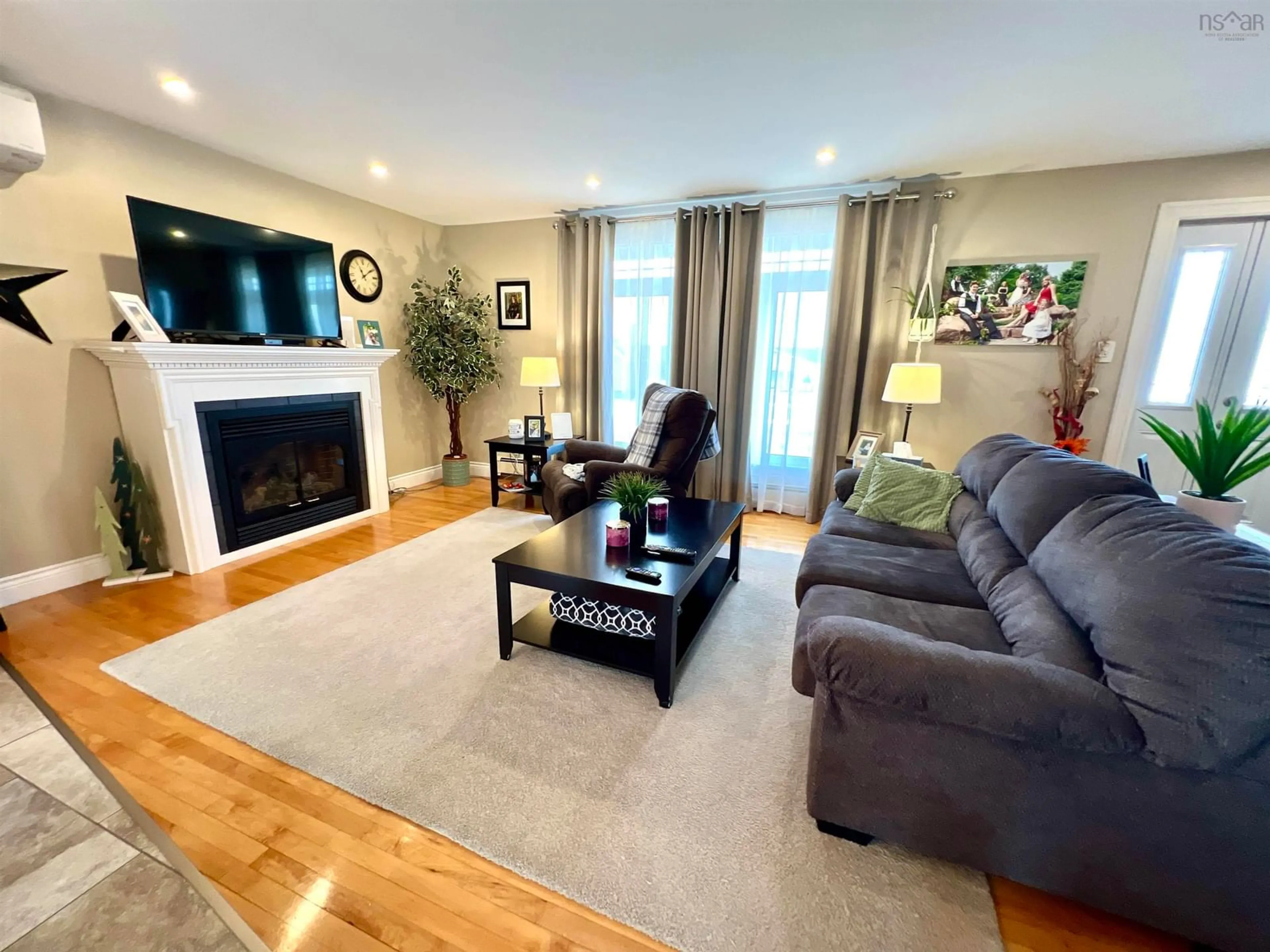 Living room with furniture, wood/laminate floor for 287 Brookside St, Glace Bay Nova Scotia B1A 1M3