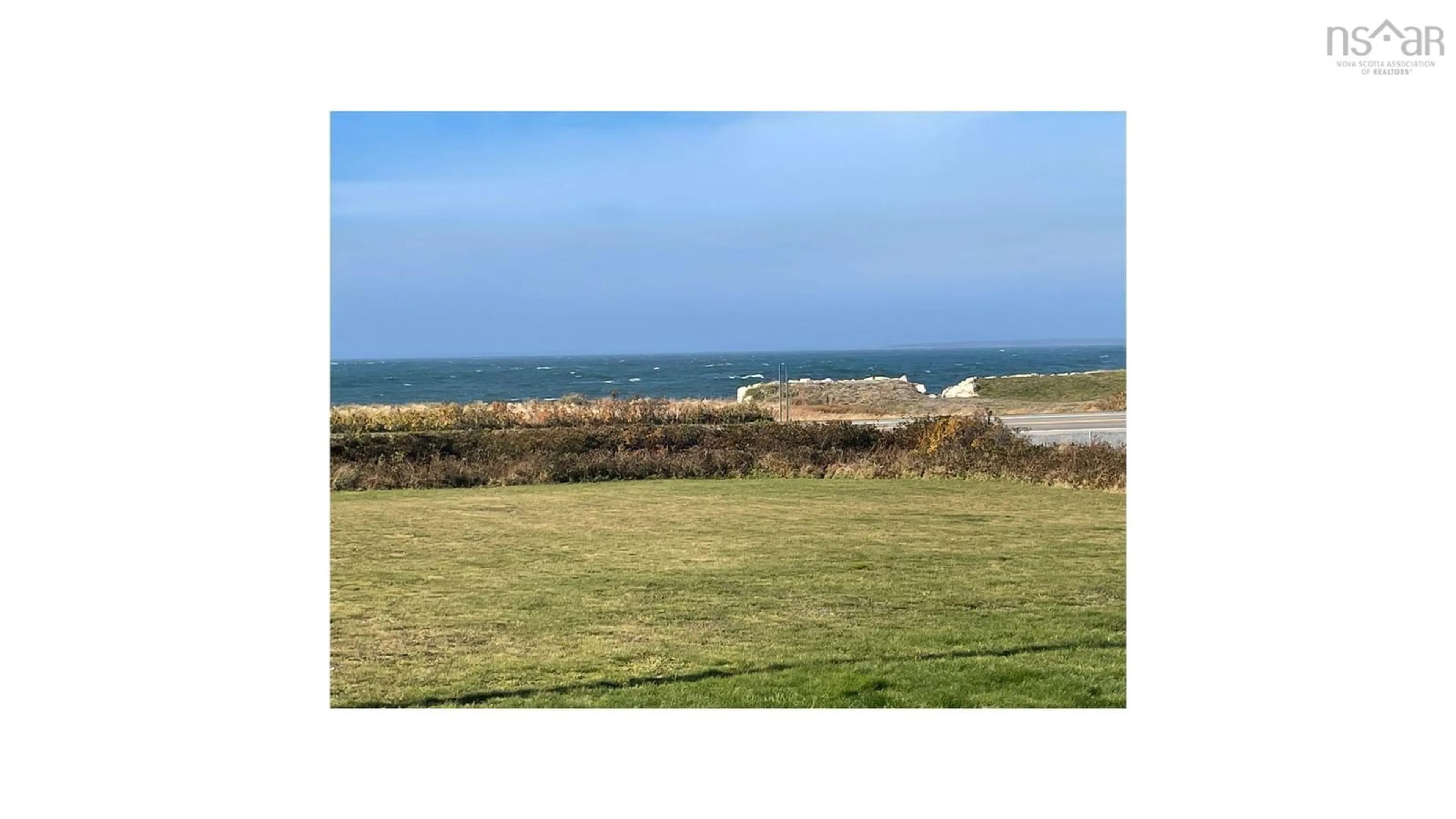 A pic from outside/outdoor area/front of a property/back of a property/a pic from drone, water/lake/river/ocean view for 2385 Main St, Clark's Harbour Nova Scotia B0W 1P0