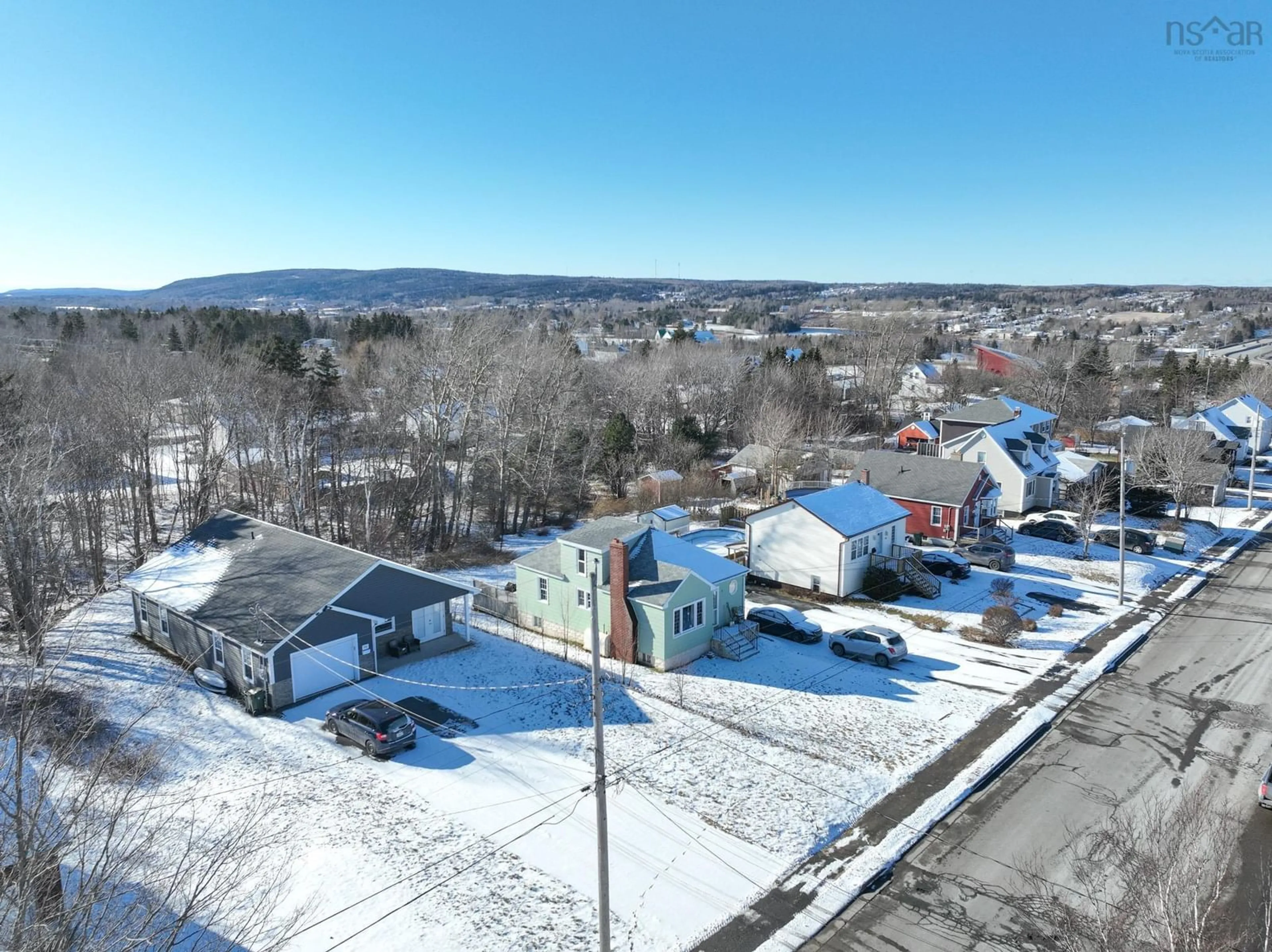 A pic from outside/outdoor area/front of a property/back of a property/a pic from drone, mountain view for 72 Macrae Ave, Sydney River Nova Scotia B1S 1M2