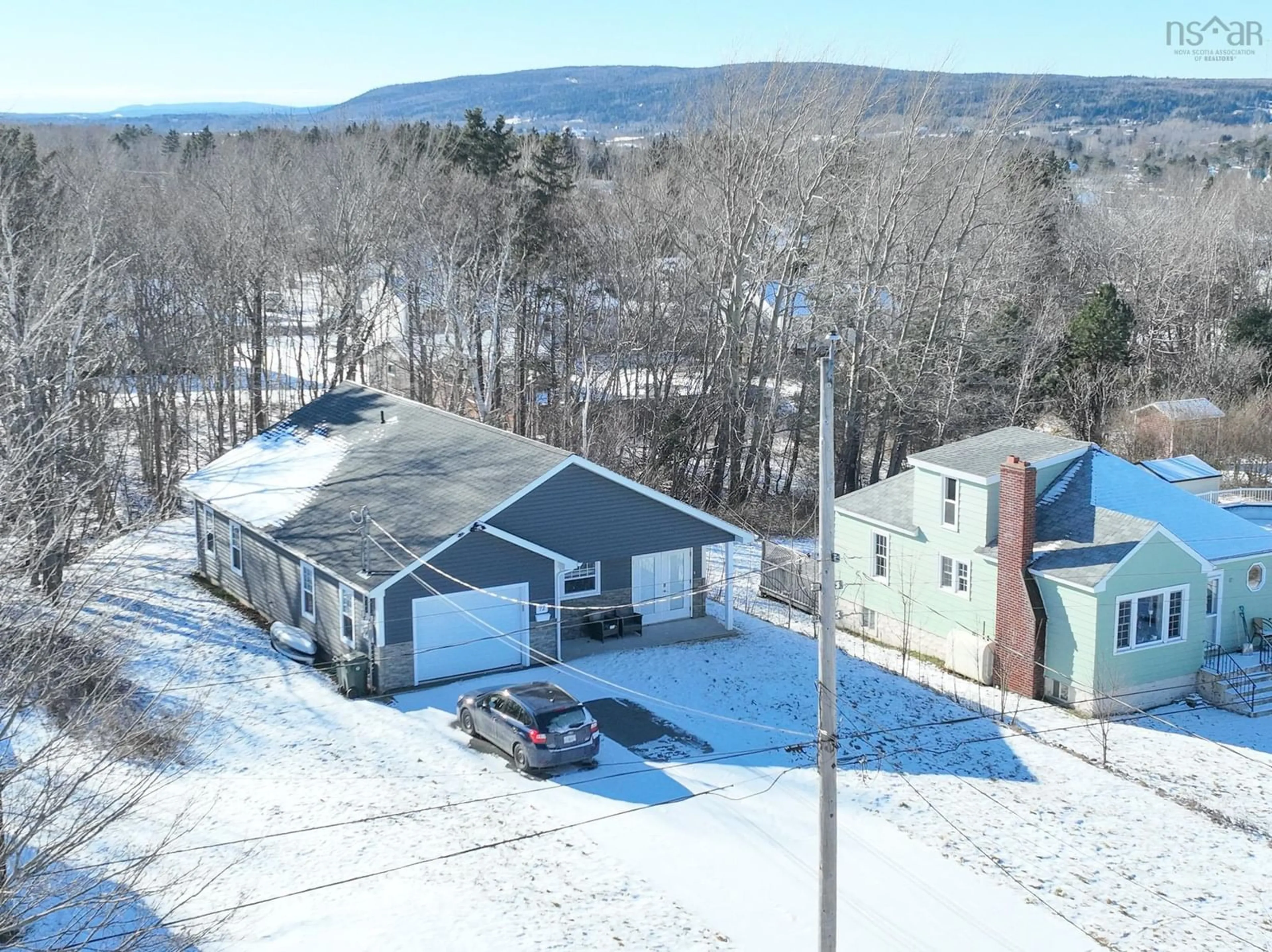 A pic from outside/outdoor area/front of a property/back of a property/a pic from drone, mountain view for 72 Macrae Ave, Sydney River Nova Scotia B1S 1M2