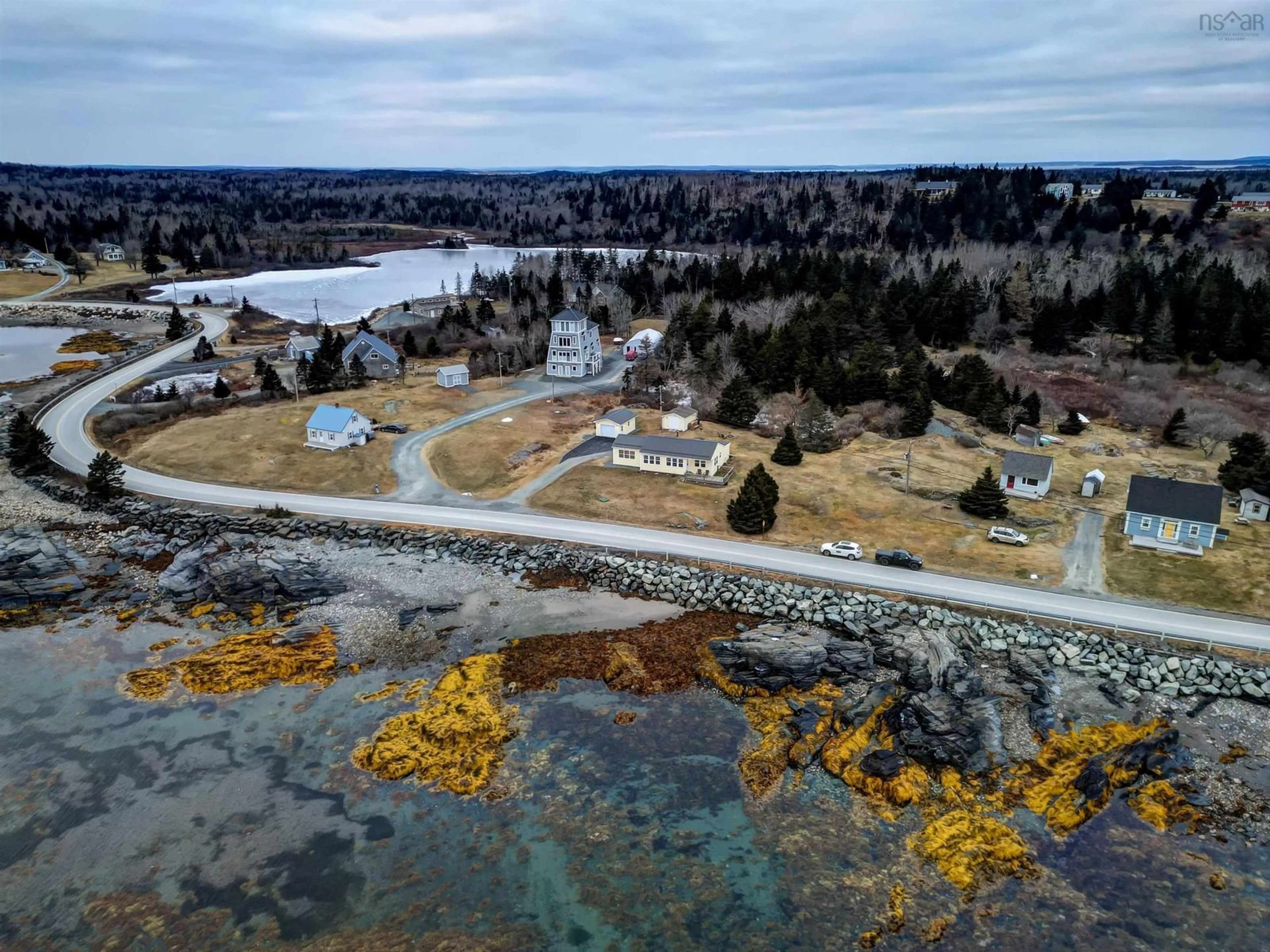 A pic from outside/outdoor area/front of a property/back of a property/a pic from drone, water/lake/river/ocean view for 1263 Blue Rocks Rd, Blue Rocks Nova Scotia B0J 2C0