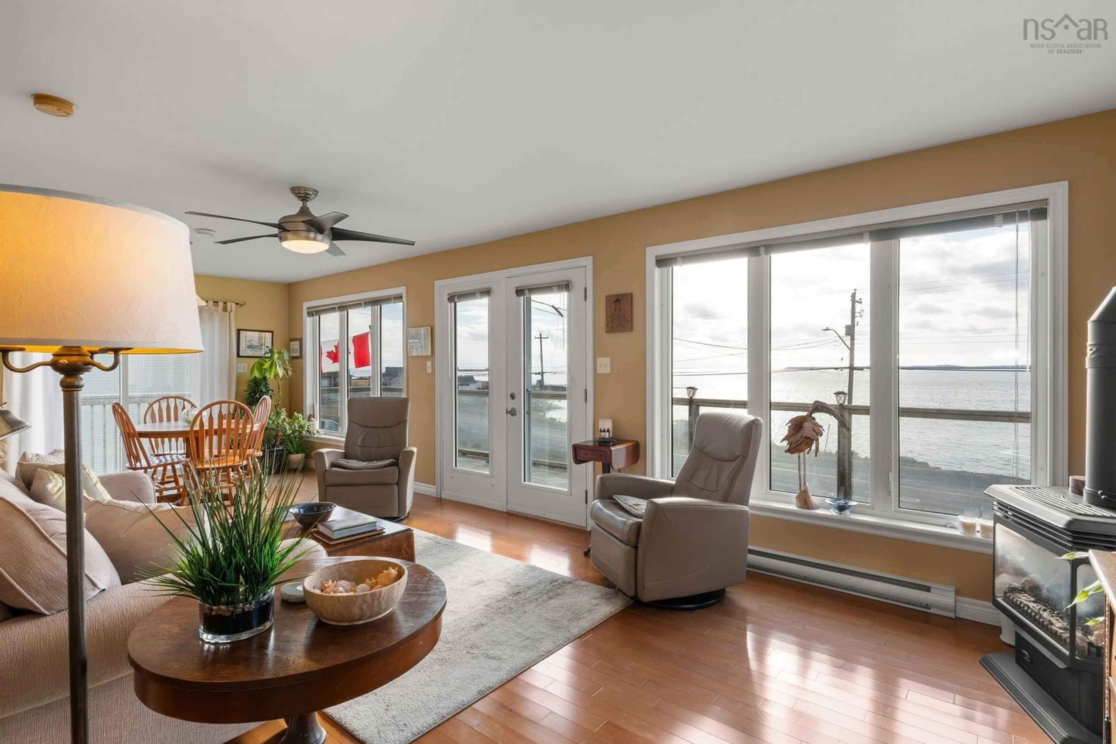 Living room with furniture, wood/laminate floor for 2184 Shore Rd, Eastern Passage Nova Scotia B3G 1H8