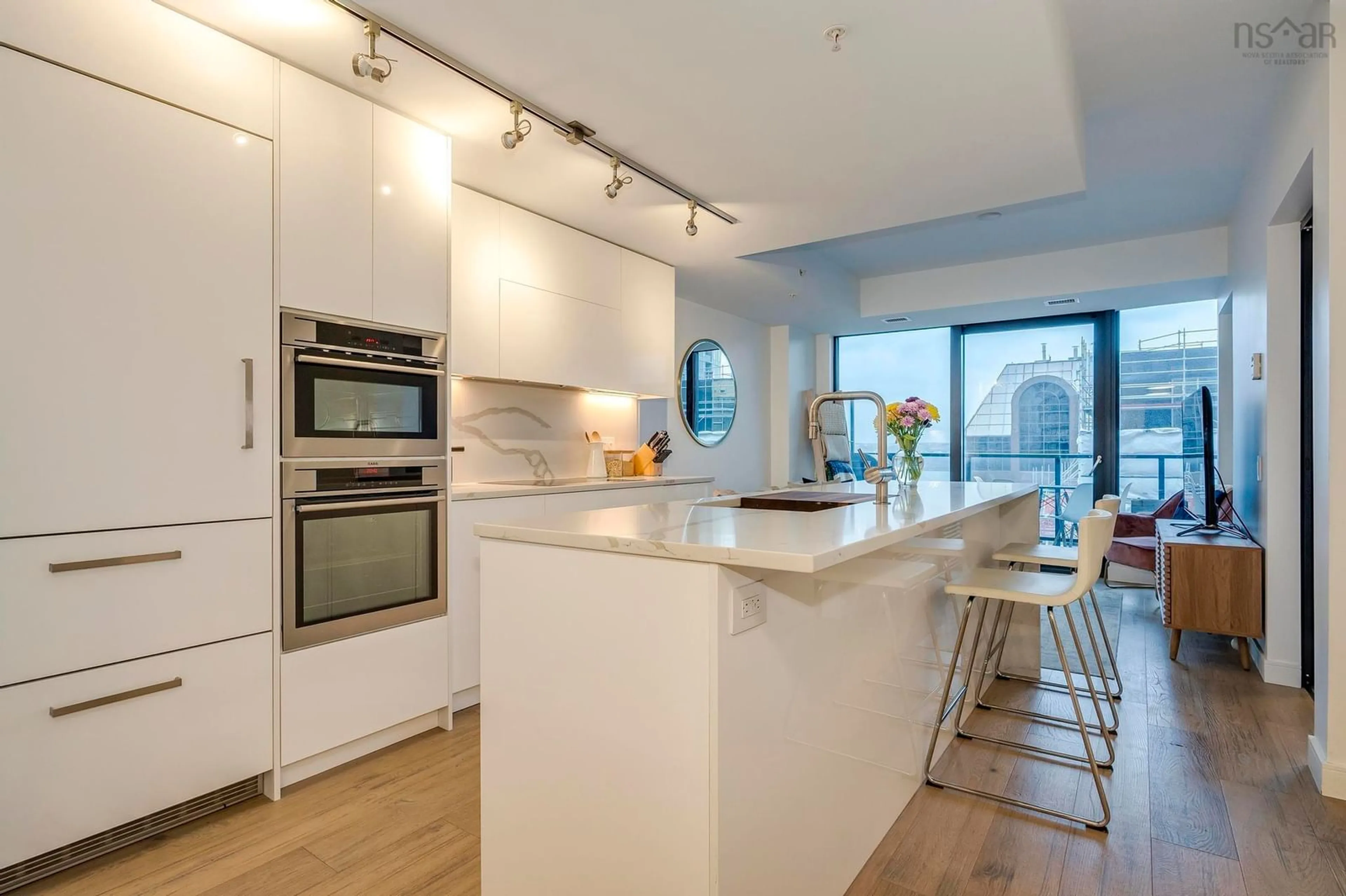 Open concept kitchen, wood/laminate floor for 1650 Granville St #1404, Halifax Nova Scotia B3J 0E1