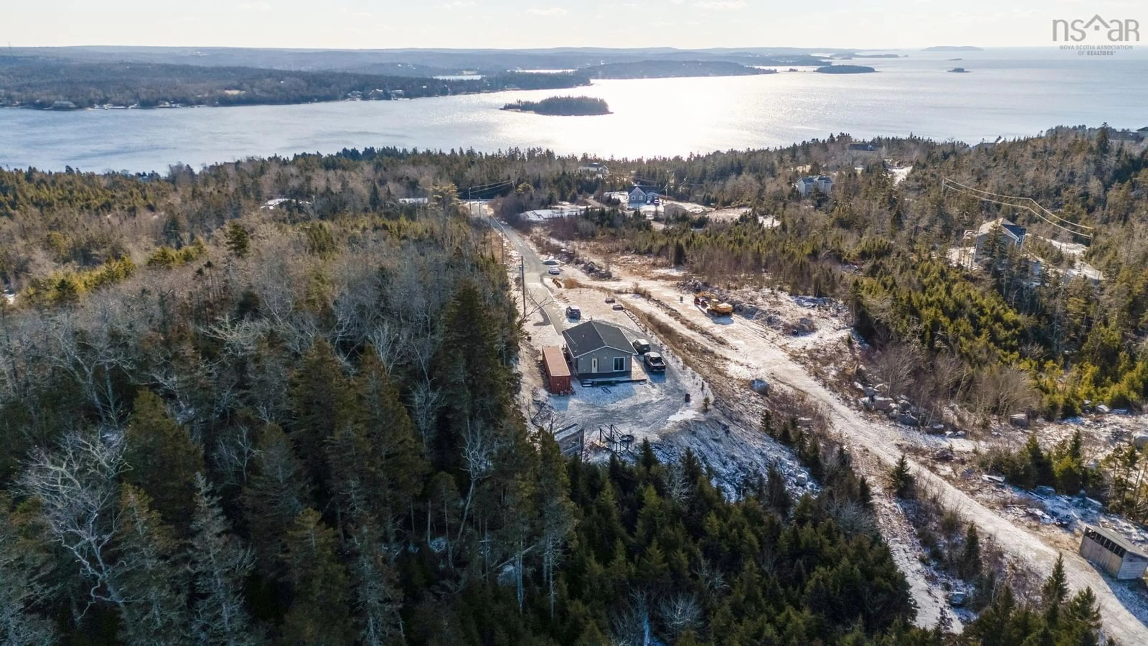 A pic from outside/outdoor area/front of a property/back of a property/a pic from drone, water/lake/river/ocean view for 166 Hillside Dr, Boutiliers Point Nova Scotia B3Z 1W8